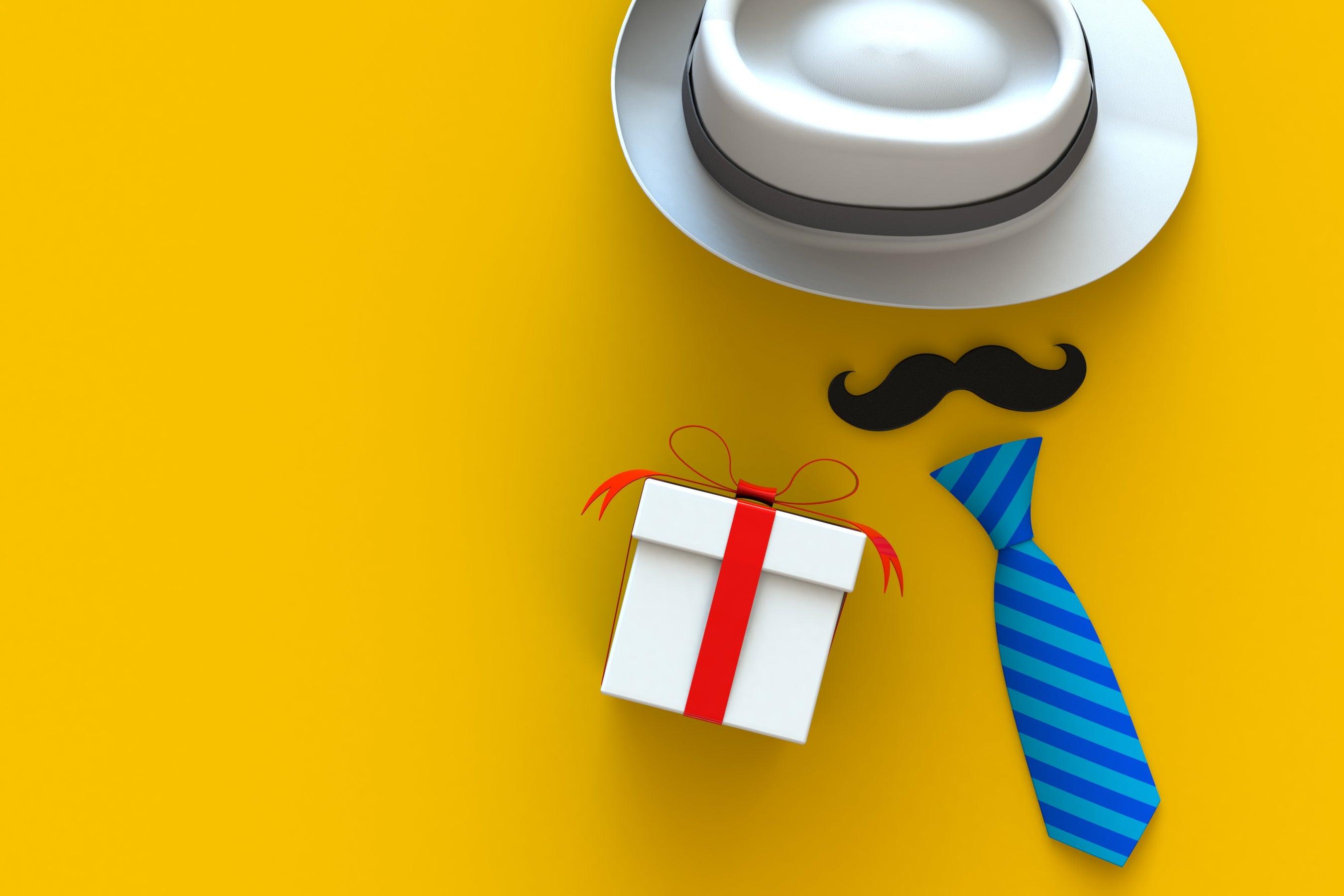 Father's Day gift box with red ribbon, blue striped tie, white hat, and mustache on yellow background