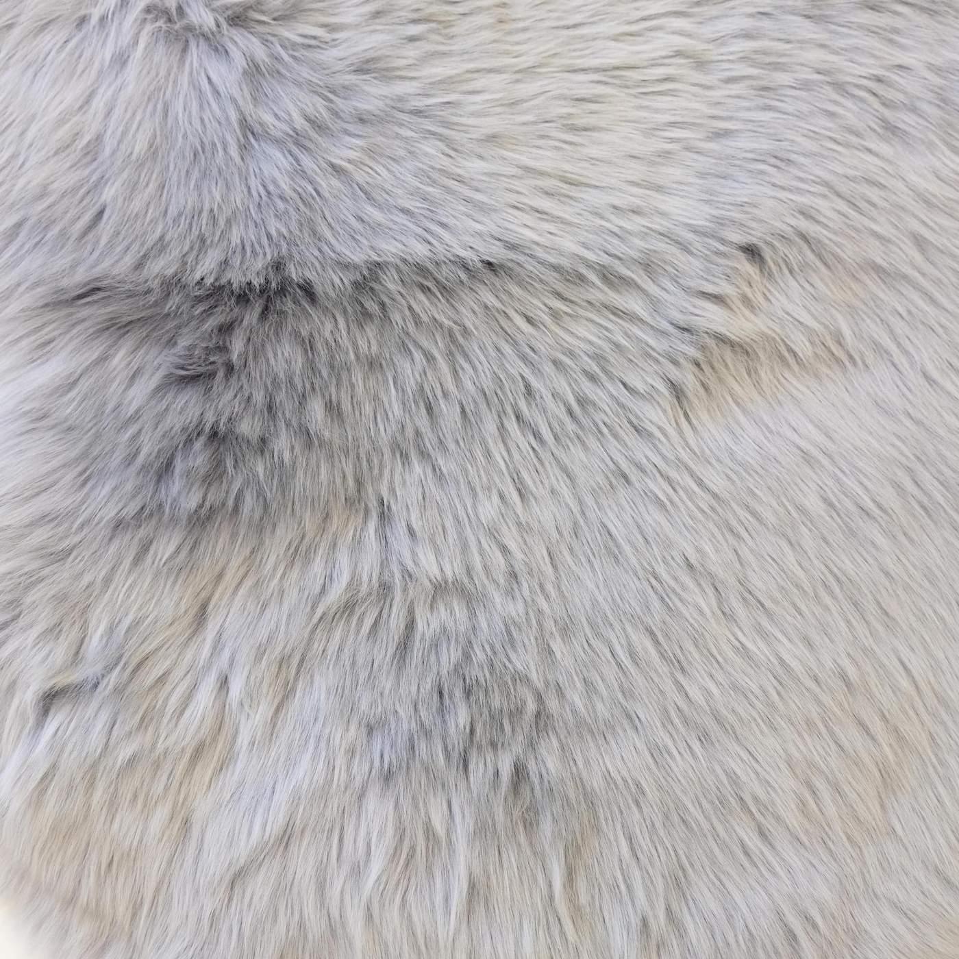Close-up of soft, long wool cloudy grey sheepskin rug texture