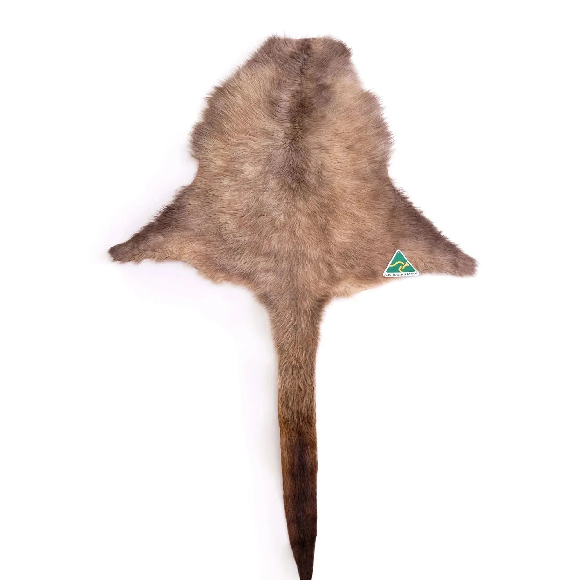 Natural brown kangaroo hide rug with a green Australian made label on white background