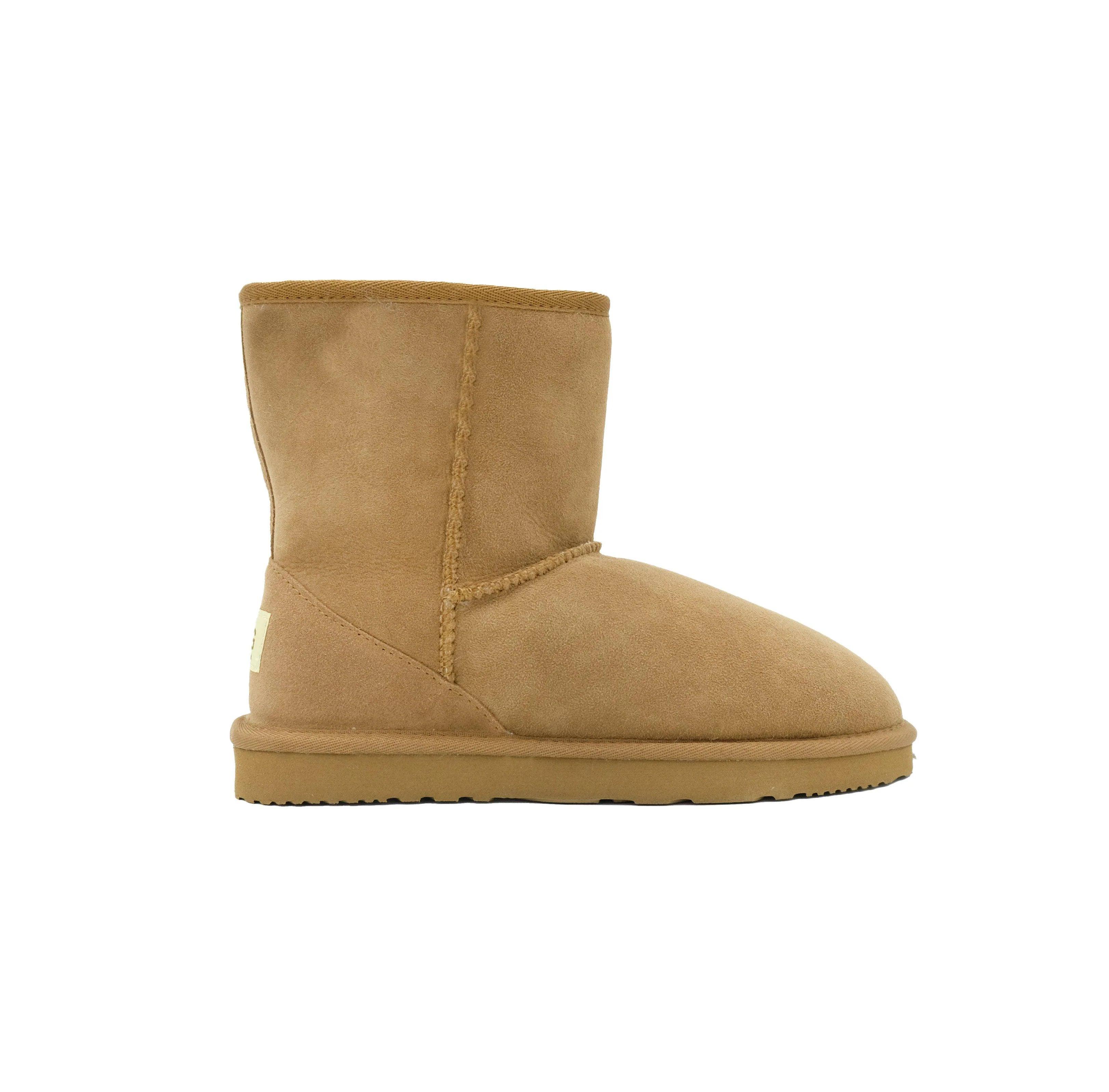 Classic chestnut tan sheepskin UGG boot with flat sole on white background