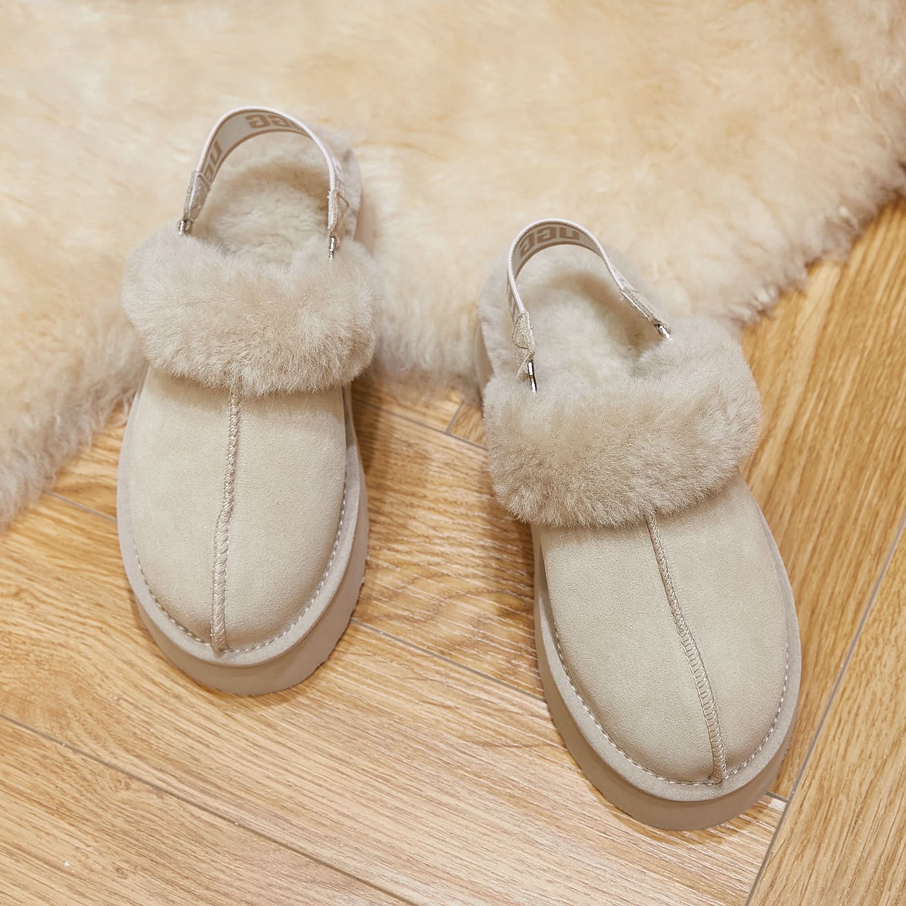 Cream sheepskin clog slippers with fluffy wool lining, top view. - Yellow Earth Australia