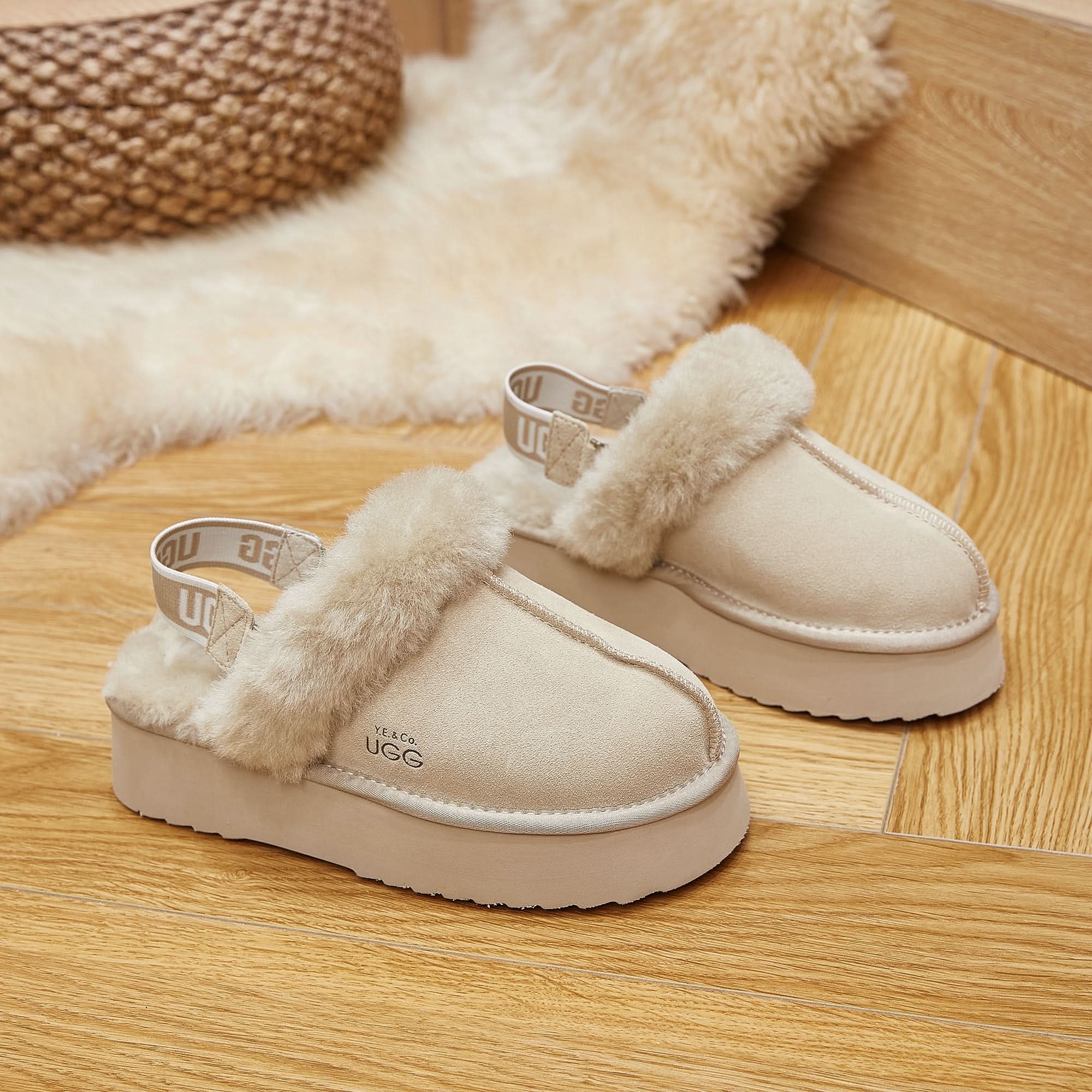 Cream sheepskin platform clogs with fluffy wool collar, front view on wooden floor. - Yellow Earth Australia