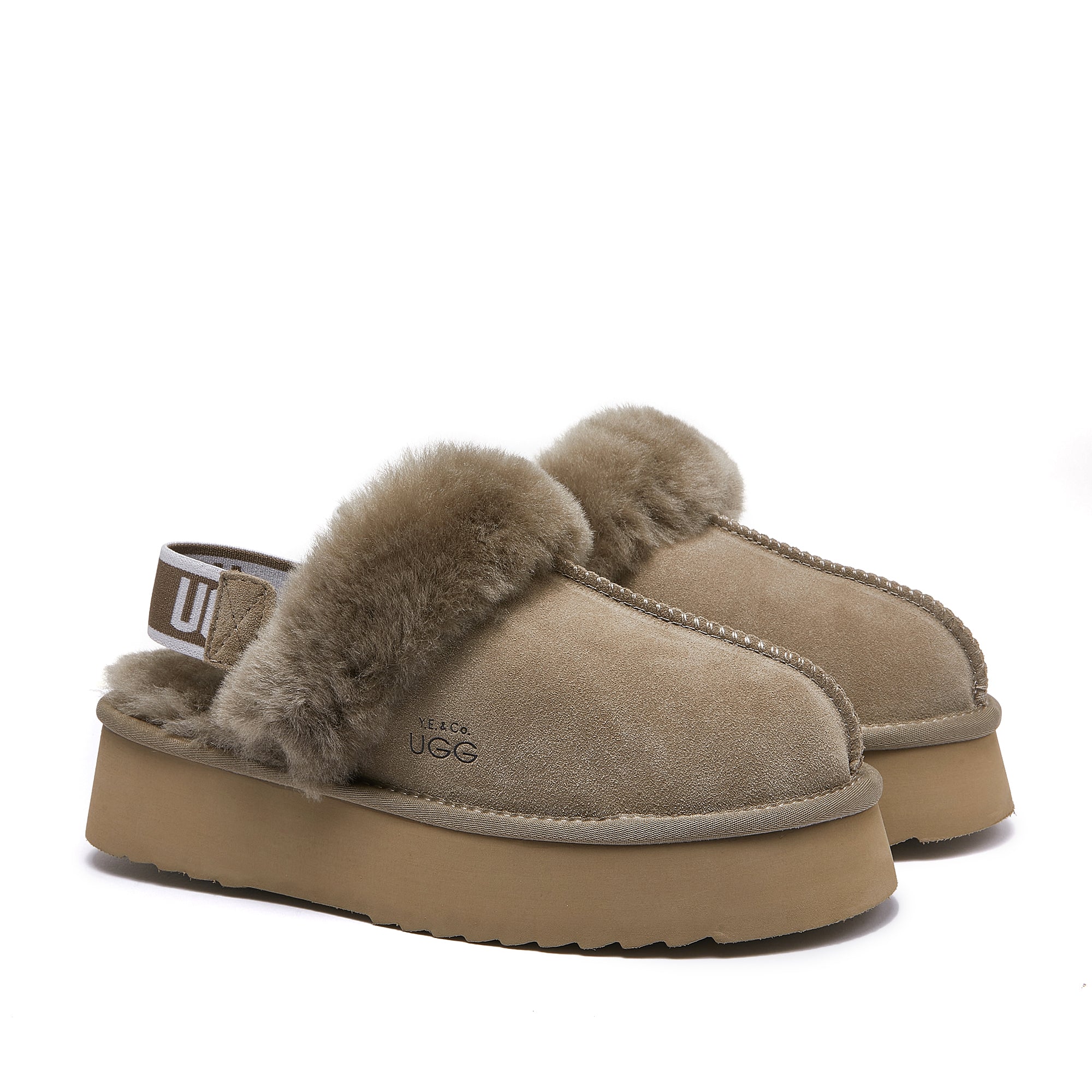 Beige platform sheepskin UGG slippers with fur lining and elastic back strap, side view