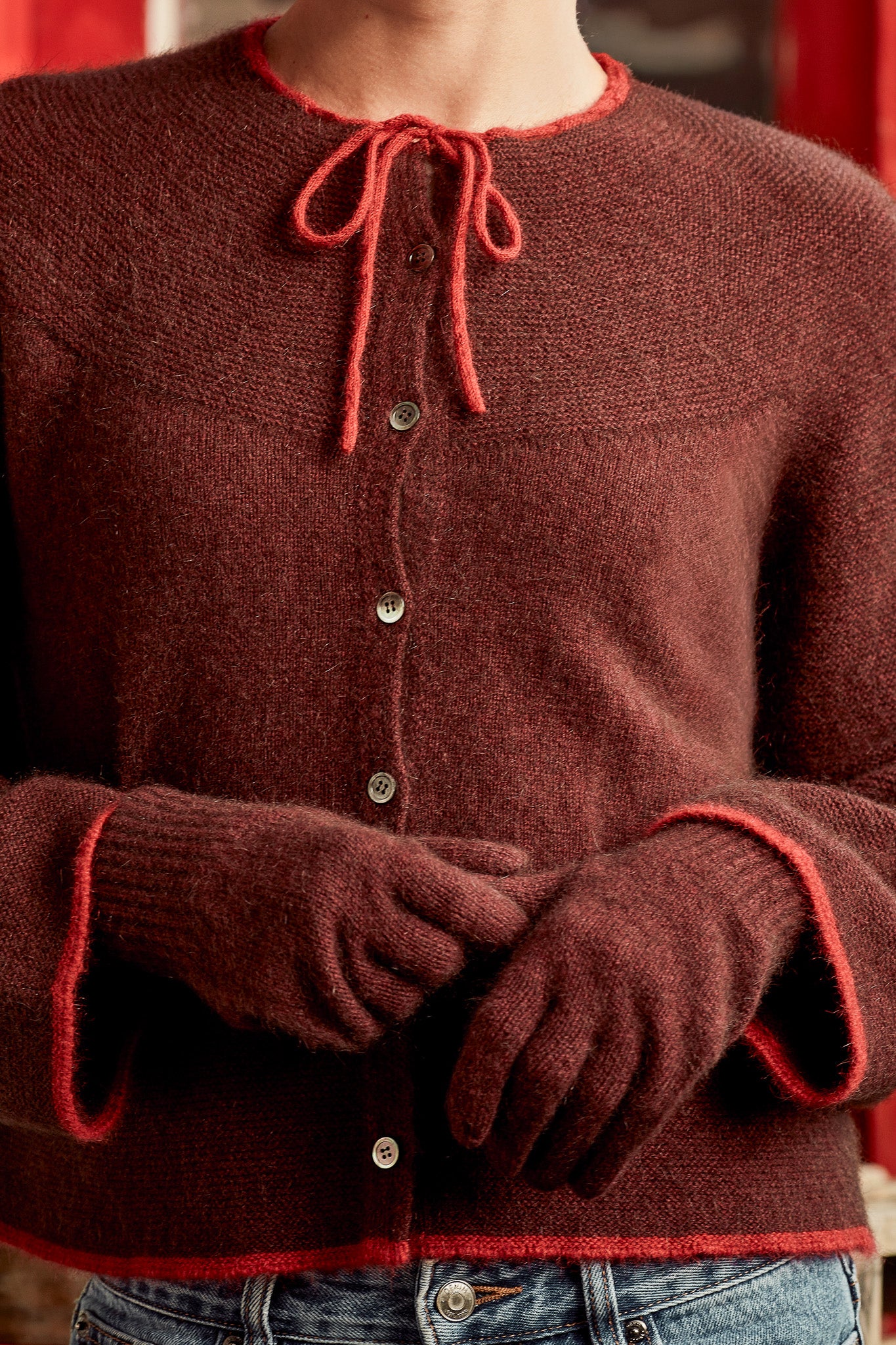 A person wearing Possum Merino Wool Silk Gloves in Waina colour