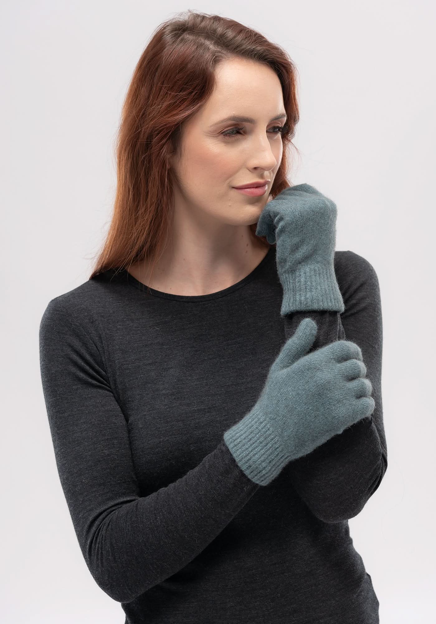Grey wool mittens on woman wearing black long-sleeve top, side view. - Yellow Earth Australia
