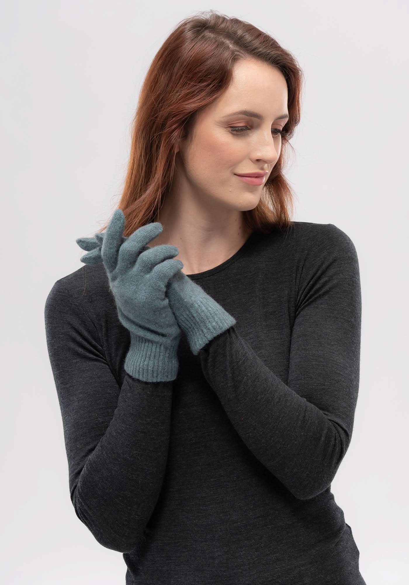 Woman wearing grey wool gloves, front three-quarter view against white background. - Yellow Earth Australia