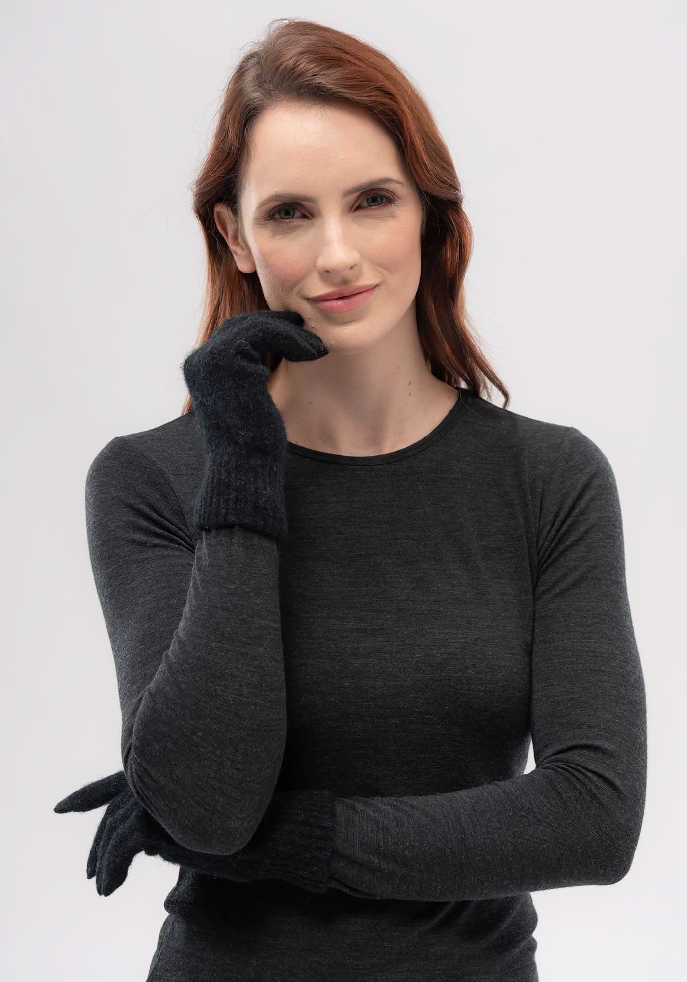 Black wool gloves displayed on model's hand, showing texture and fit. - Yellow Earth Australia