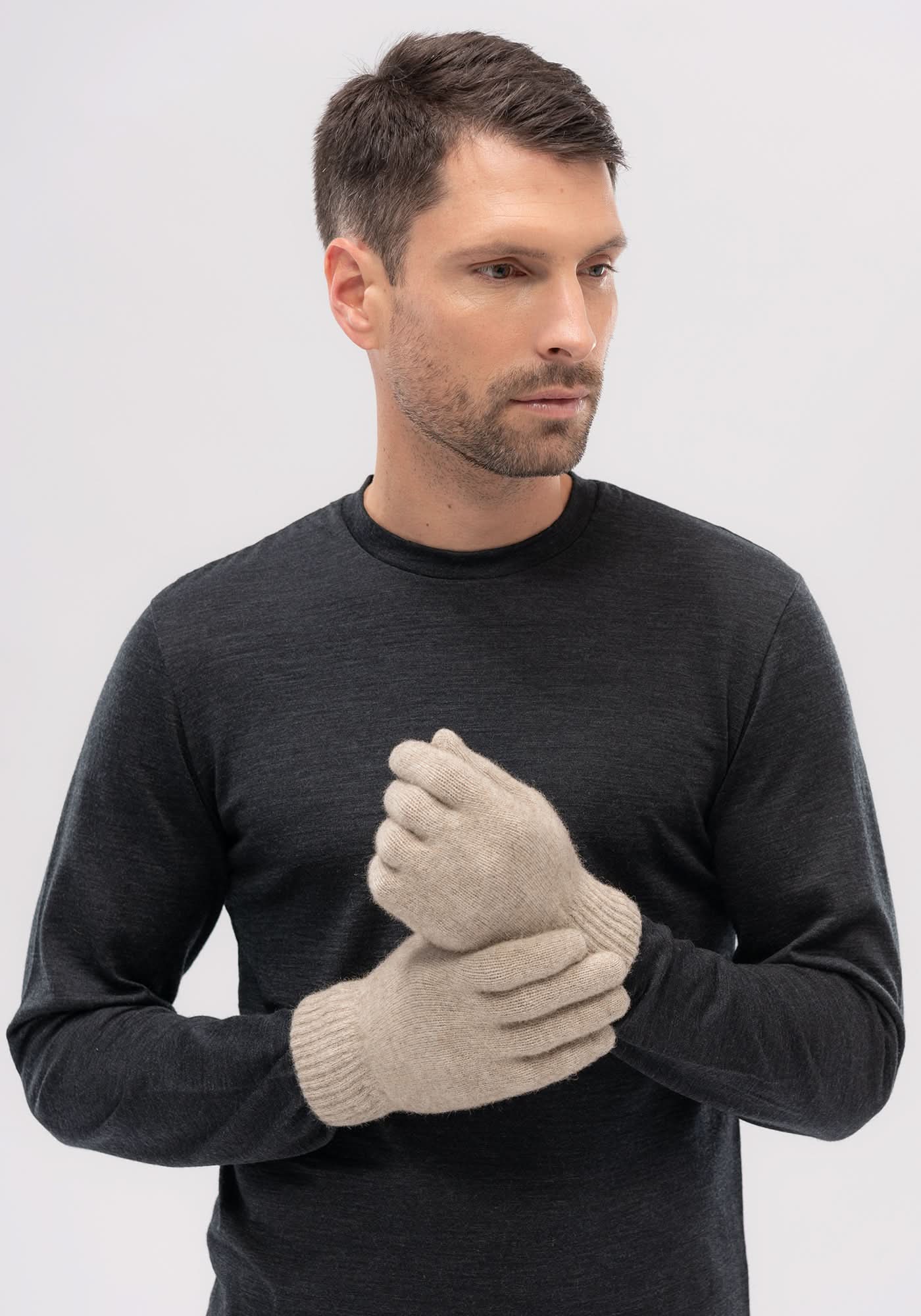 Cream wool gloves worn on model in front view against neutral background. - Yellow Earth Australia