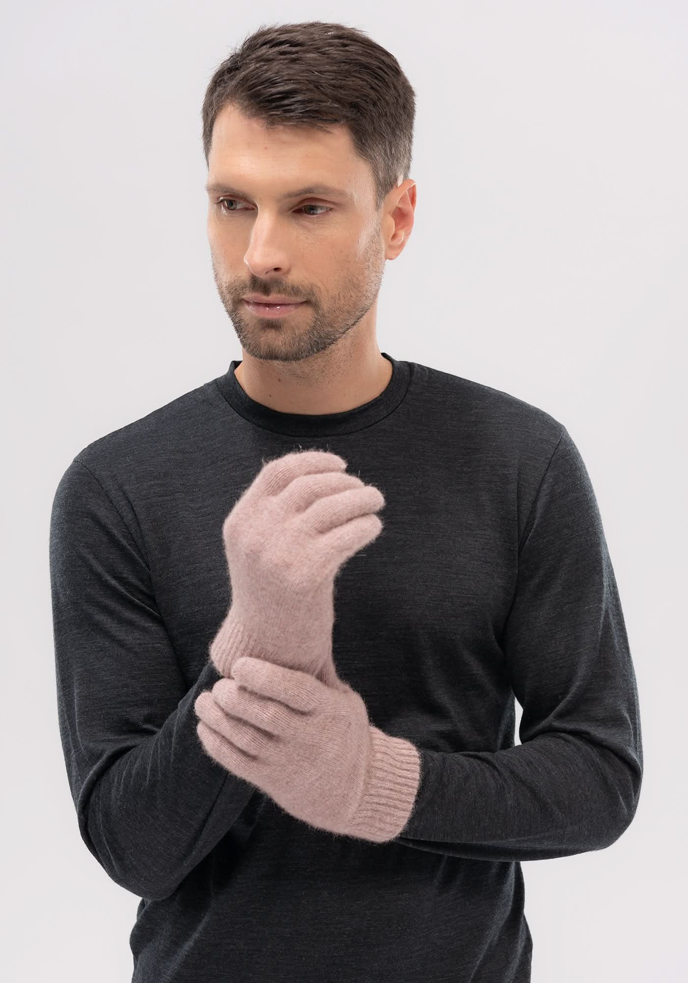 Man wearing beige wool gloves with charcoal sweater, front view. - Yellow Earth Australia