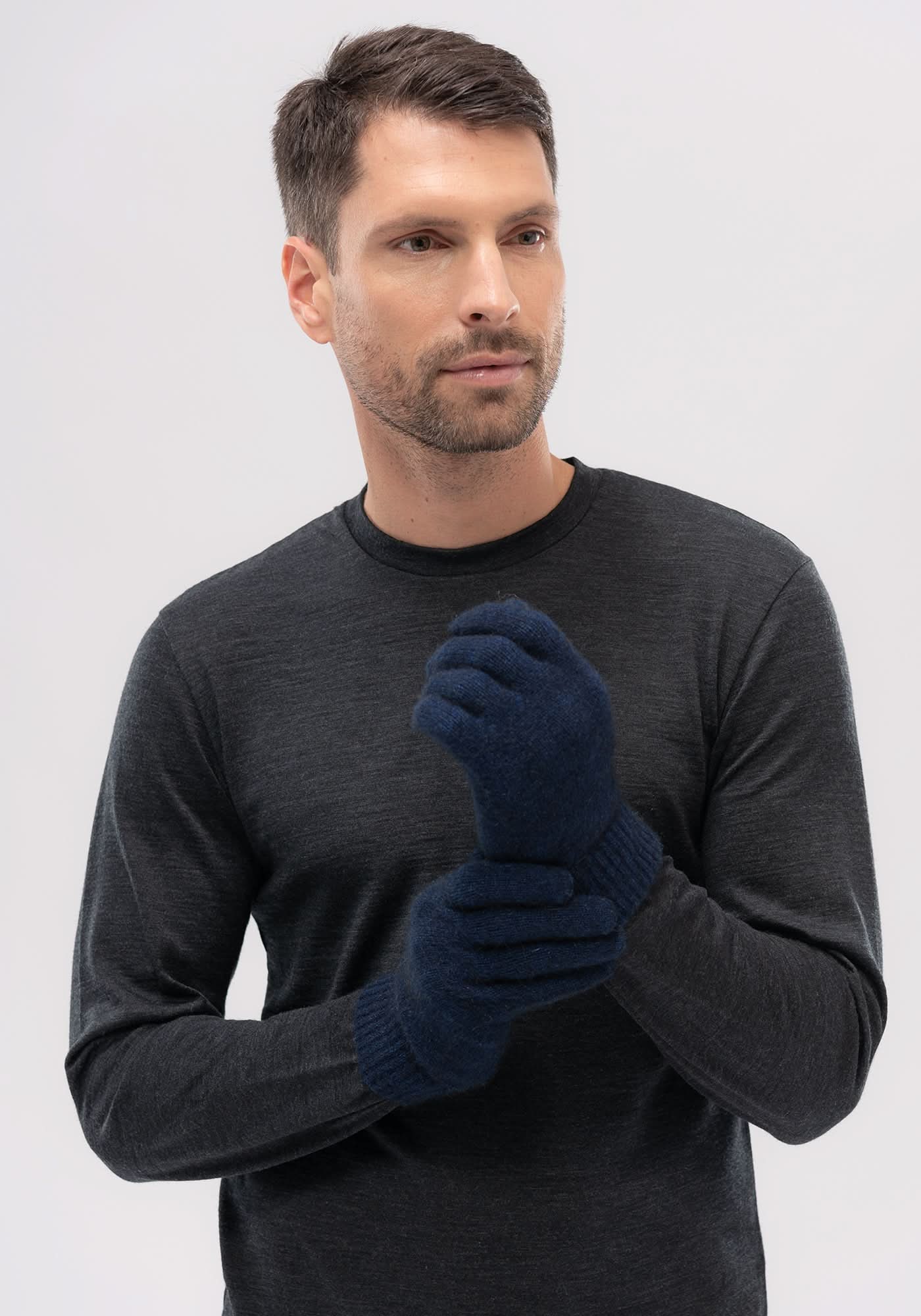 Dark blue wool gloves on man wearing charcoal long-sleeve shirt, front view. - Yellow Earth Australia