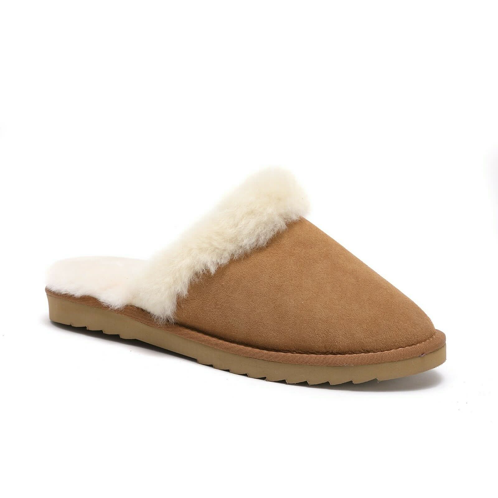 Tan sheepskin slip-on moccasin with plush wool lining on rubber sole, cozy indoor footwear