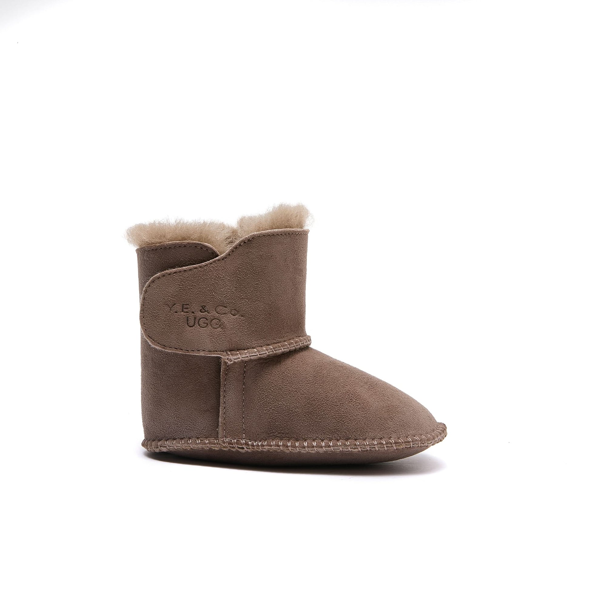 Beige sheepskin baby boot with wool lining, side view on white background. - Yellow Earth Australia