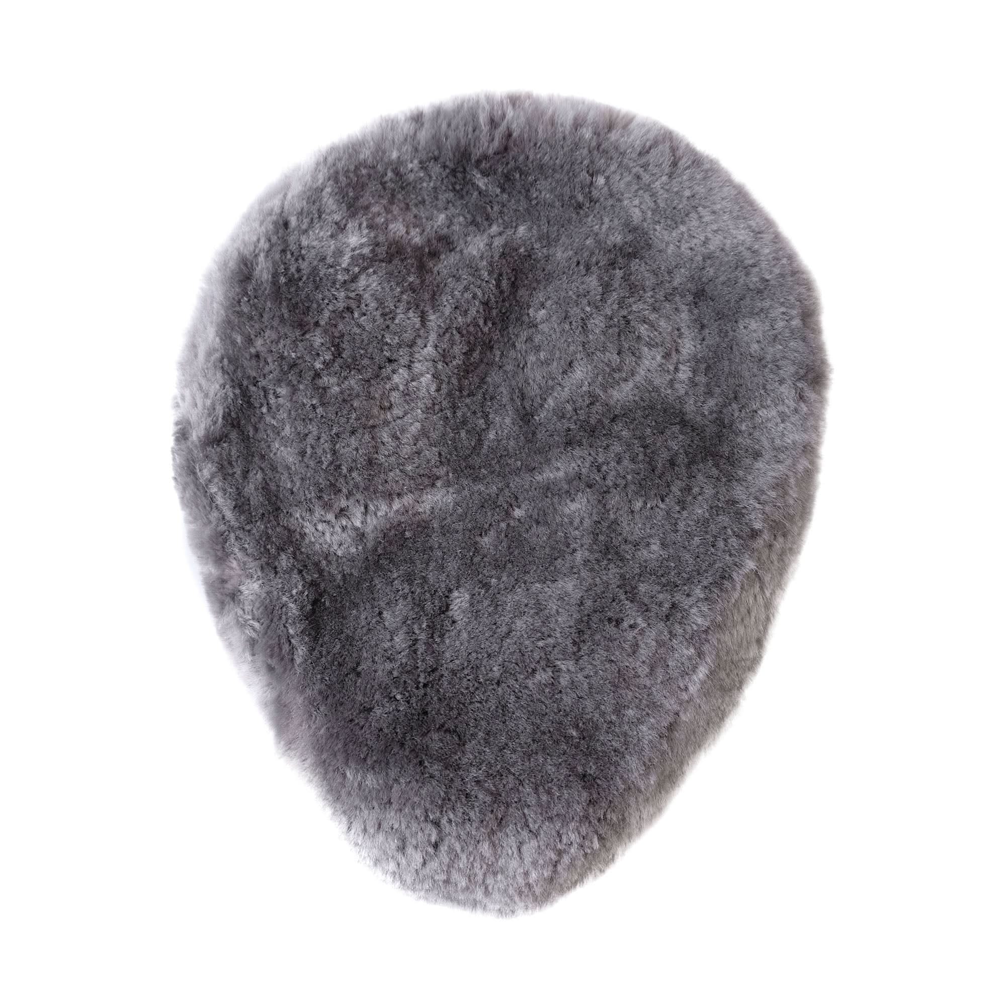 Grey sheepskin rug with soft wool pile viewed from above on white background. - Yellow Earth Australia