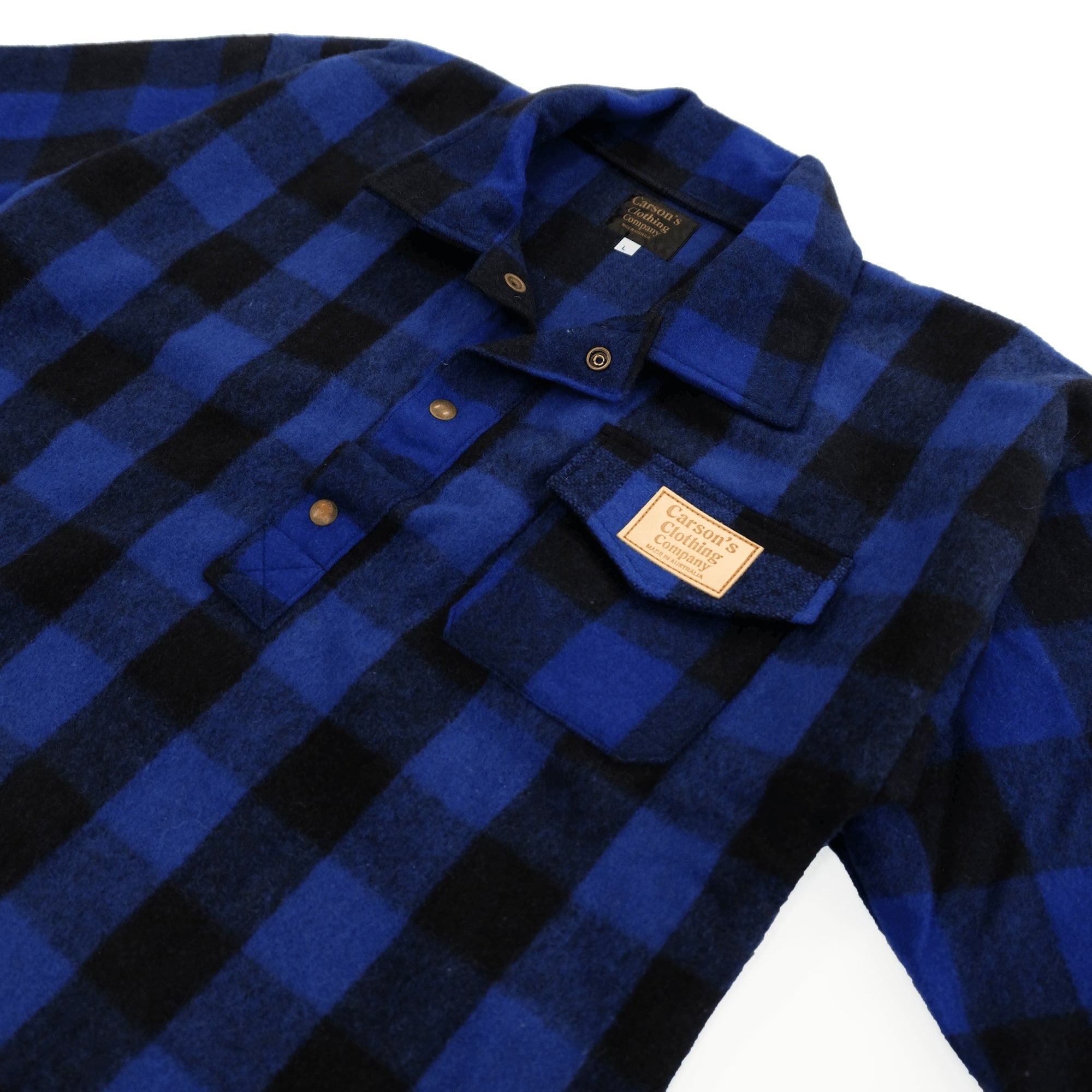 Blue and black checked wool shirt with chest pocket, flat lay view. - Yellow Earth Australia