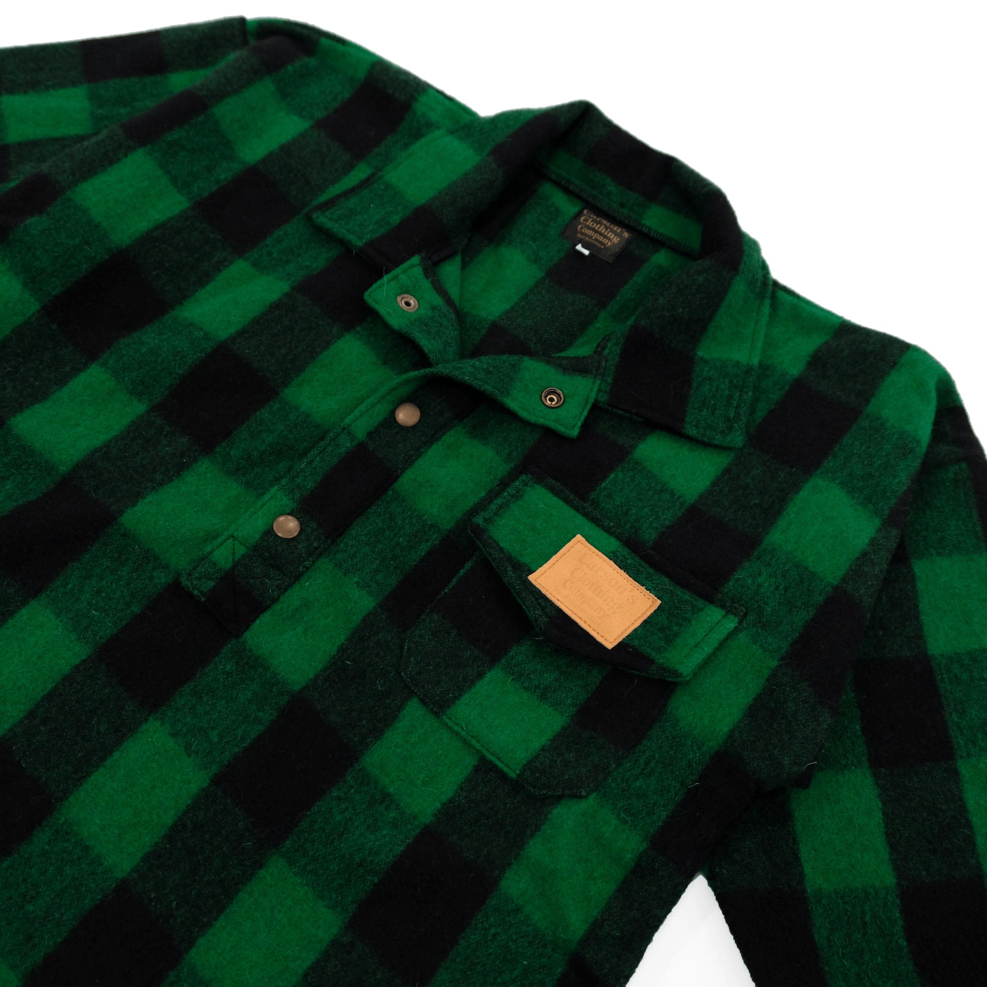 Green and black buffalo check flannel shirt with leather patch, front detail view. - Yellow Earth Australia