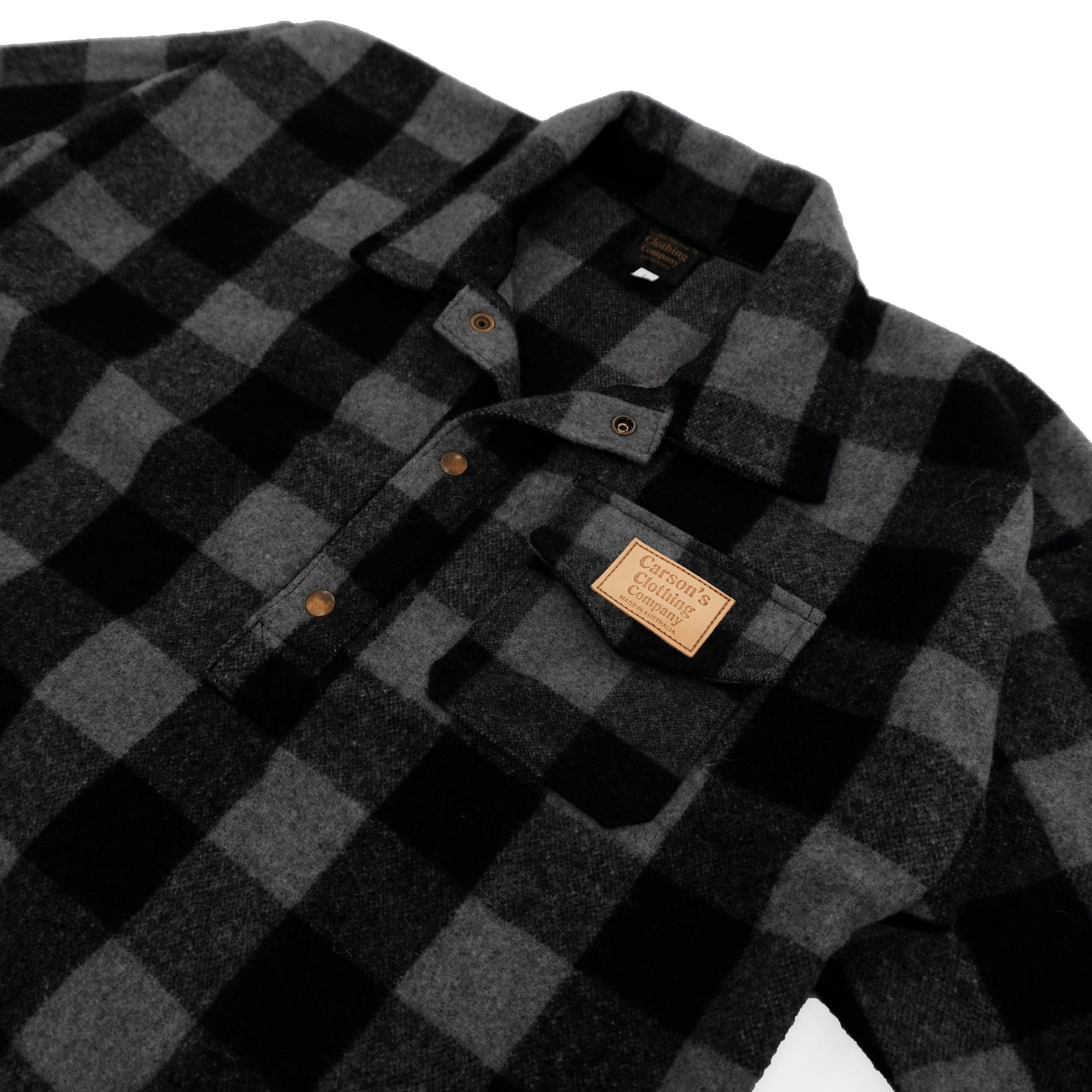 Black and charcoal buffalo check wool shirt displayed flat lay with visible buttons and labels. - Yellow Earth Australia