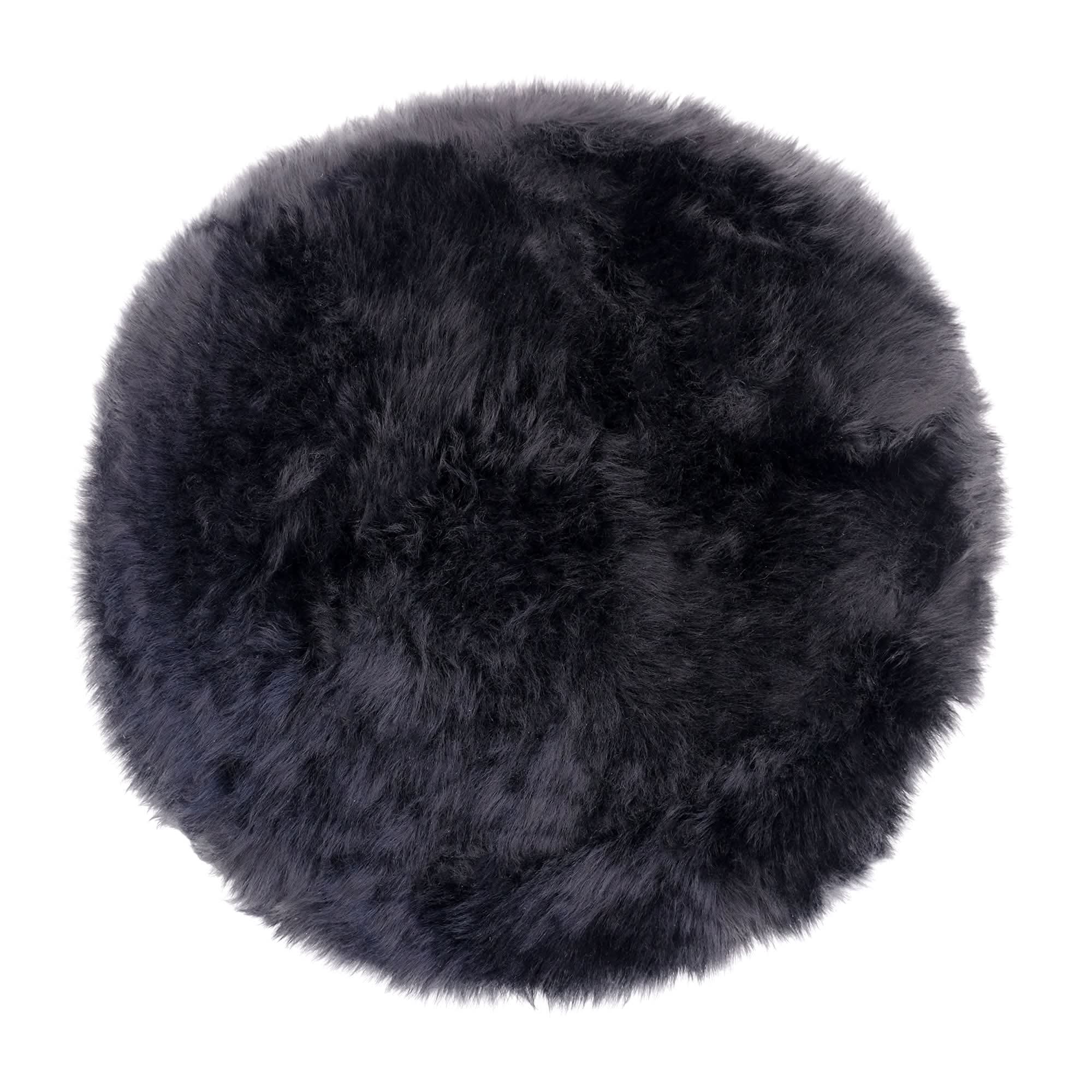 Black sheepskin round rug with luxurious wool pile, viewed from above. - Yellow Earth Australia