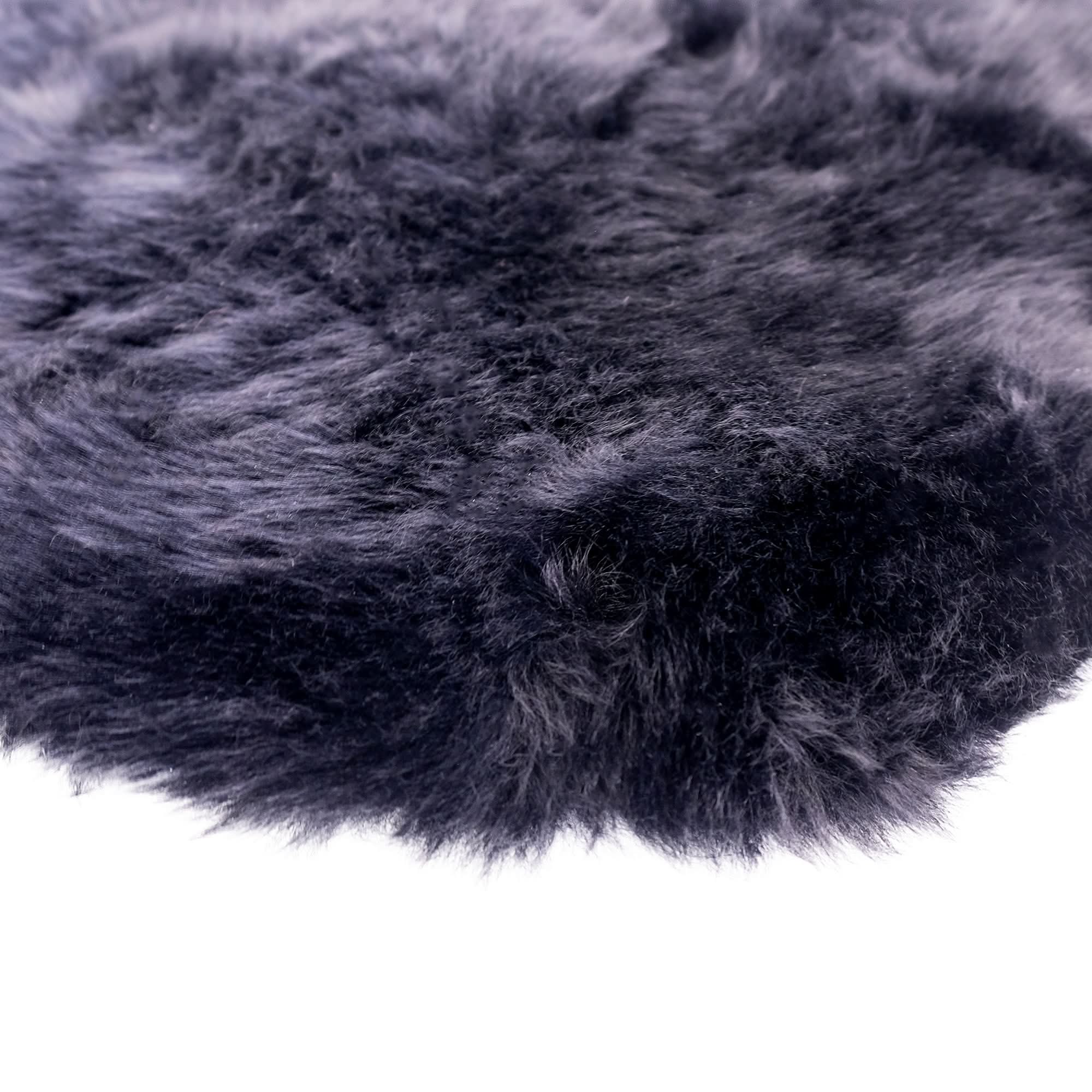 Charcoal grey sheepskin rug with soft woolly texture viewed from above. - Yellow Earth Australia