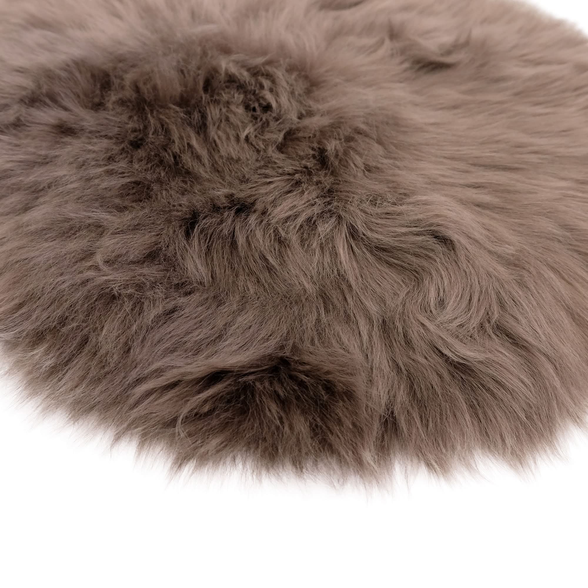Grey sheepskin rug with soft wool texture viewed from above on white background. - Yellow Earth Australia