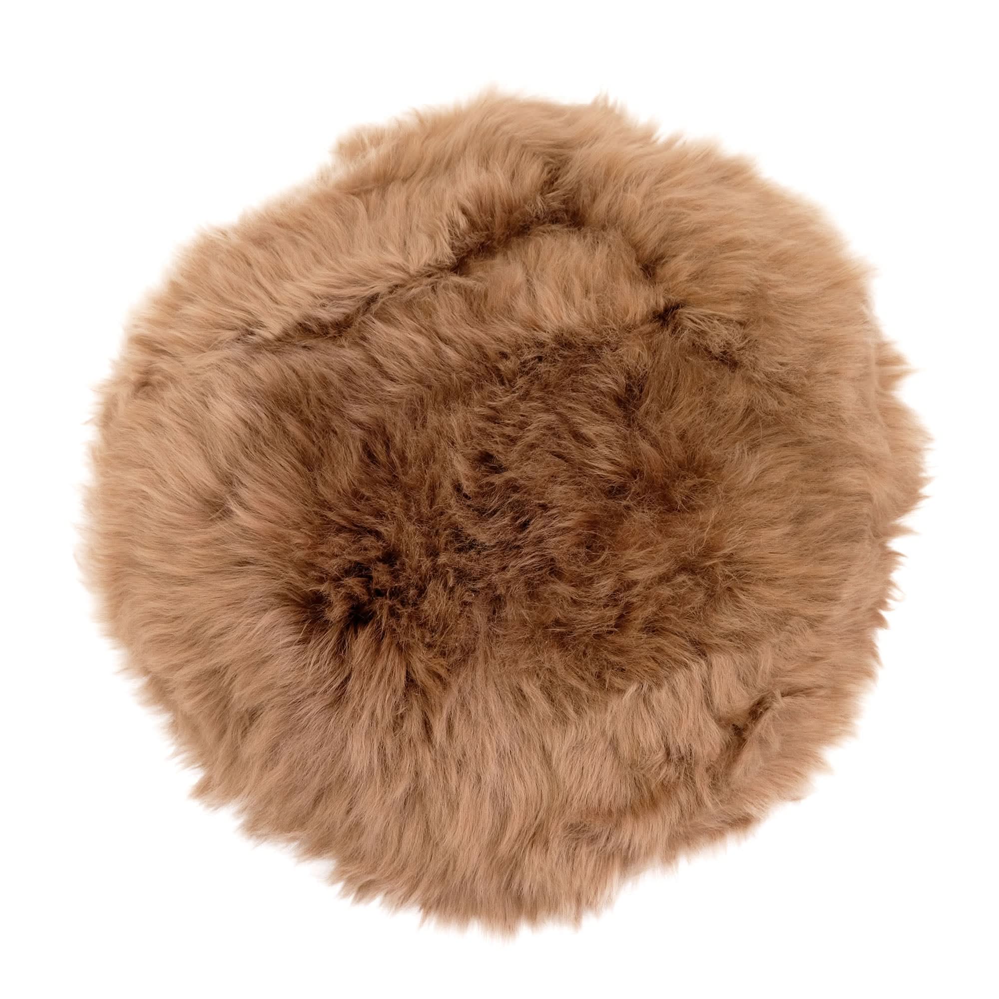 Fluffy sheepskin rug in natural tan viewed from above on white background. - Yellow Earth Australia