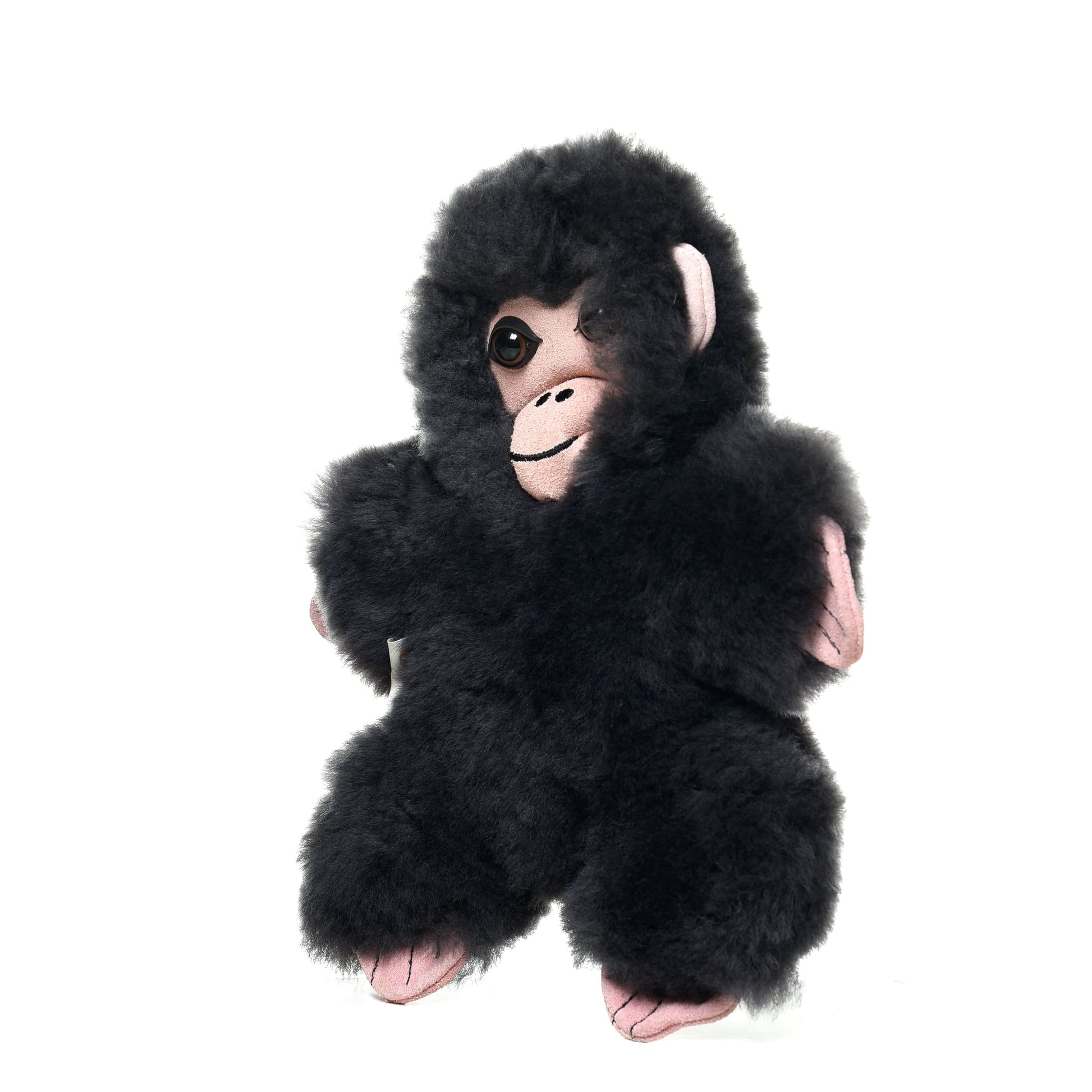 Fluffy black sheepskin baby chimpanzee toy with pink accents, front view. - Yellow Earth Australia