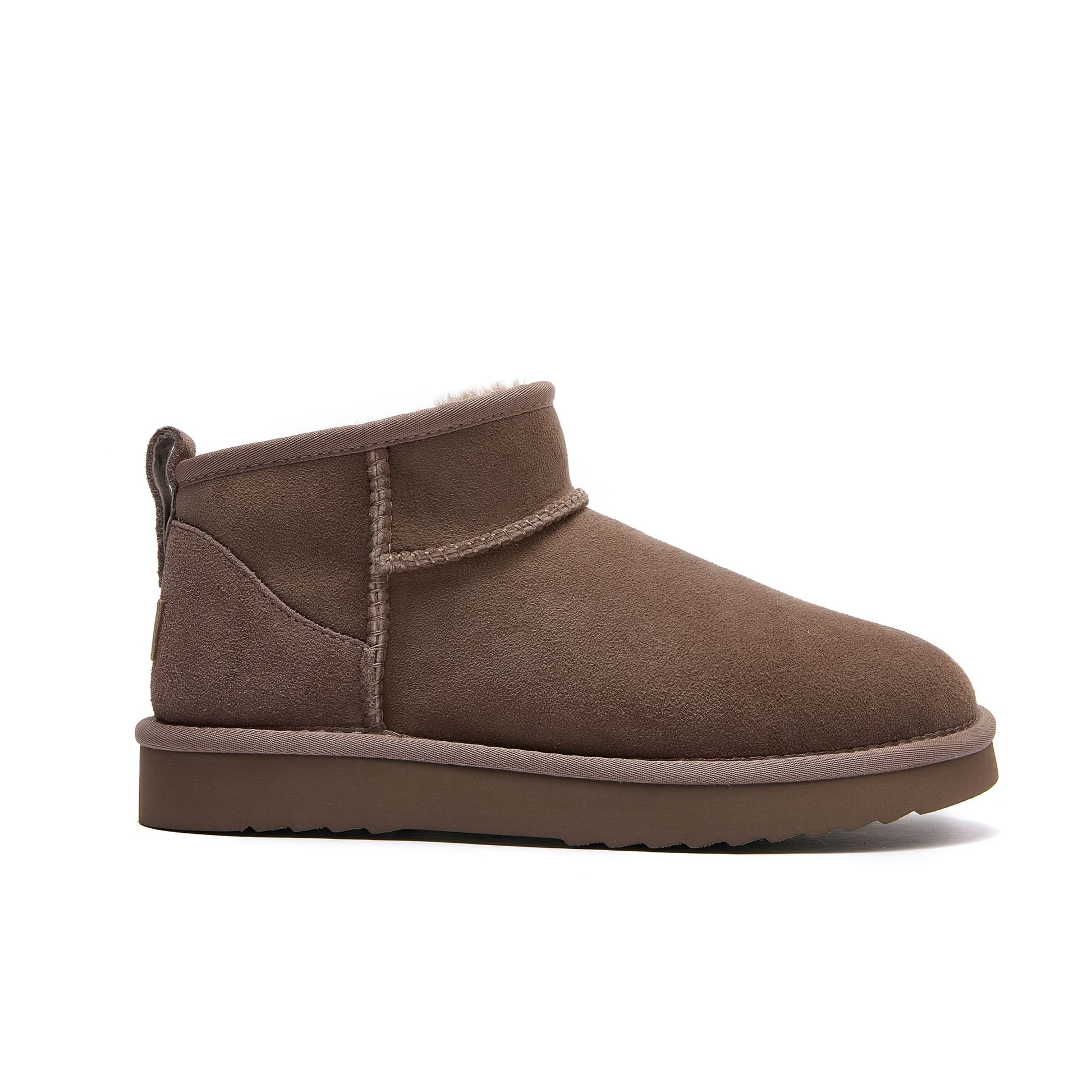 Brown suede mini ugg boot with sheepskin lining, side view. - Yellow Earth Australia
