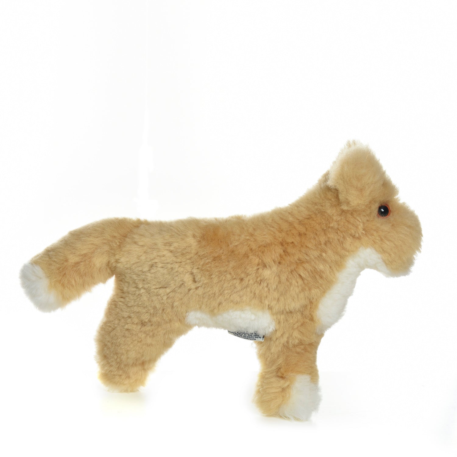 Cream alpaca plush toy with white paws and tail, side view on white background. - Yellow Earth Australia