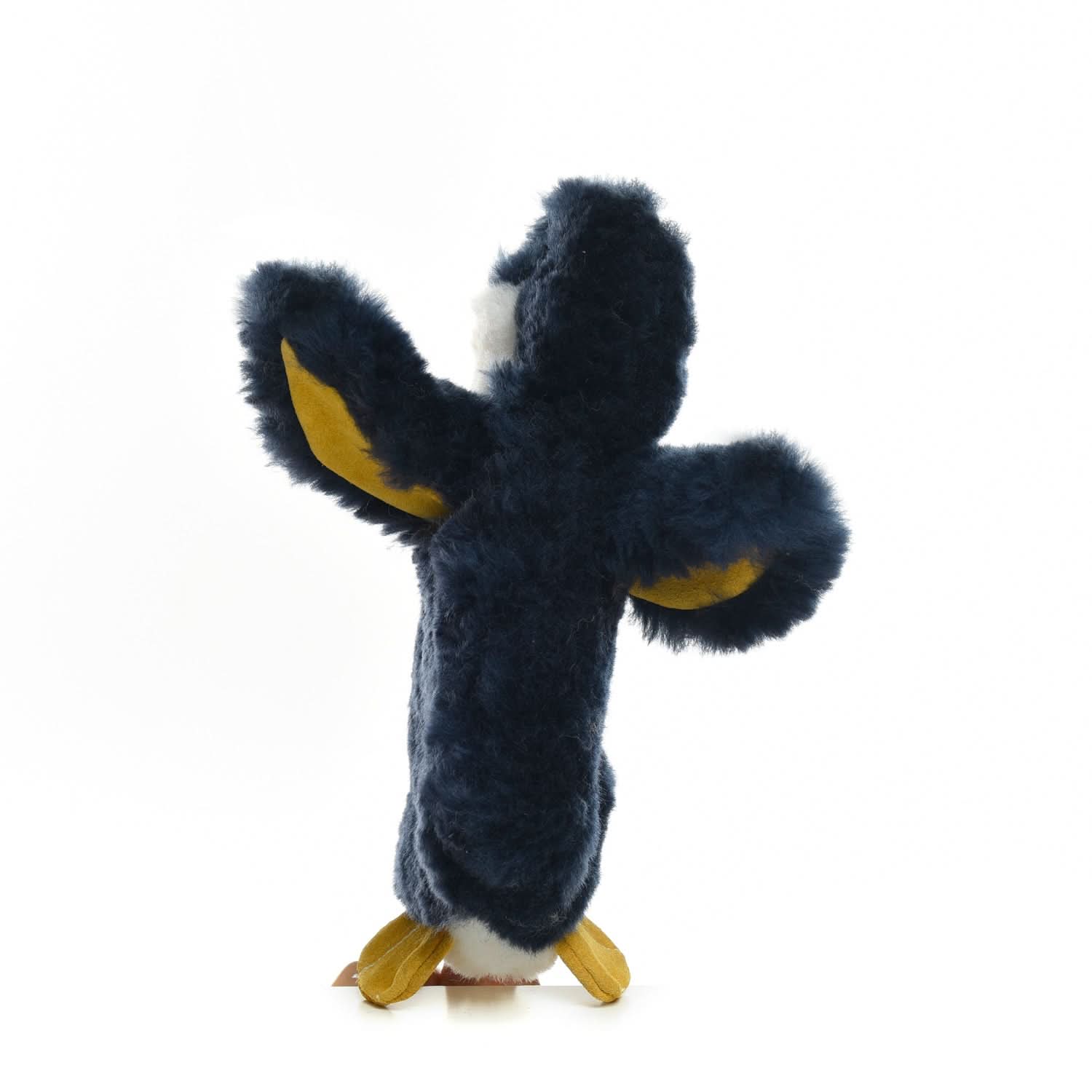Fluffy black and gold sheepskin toy with outstretched arms, front view. - Yellow Earth Australia