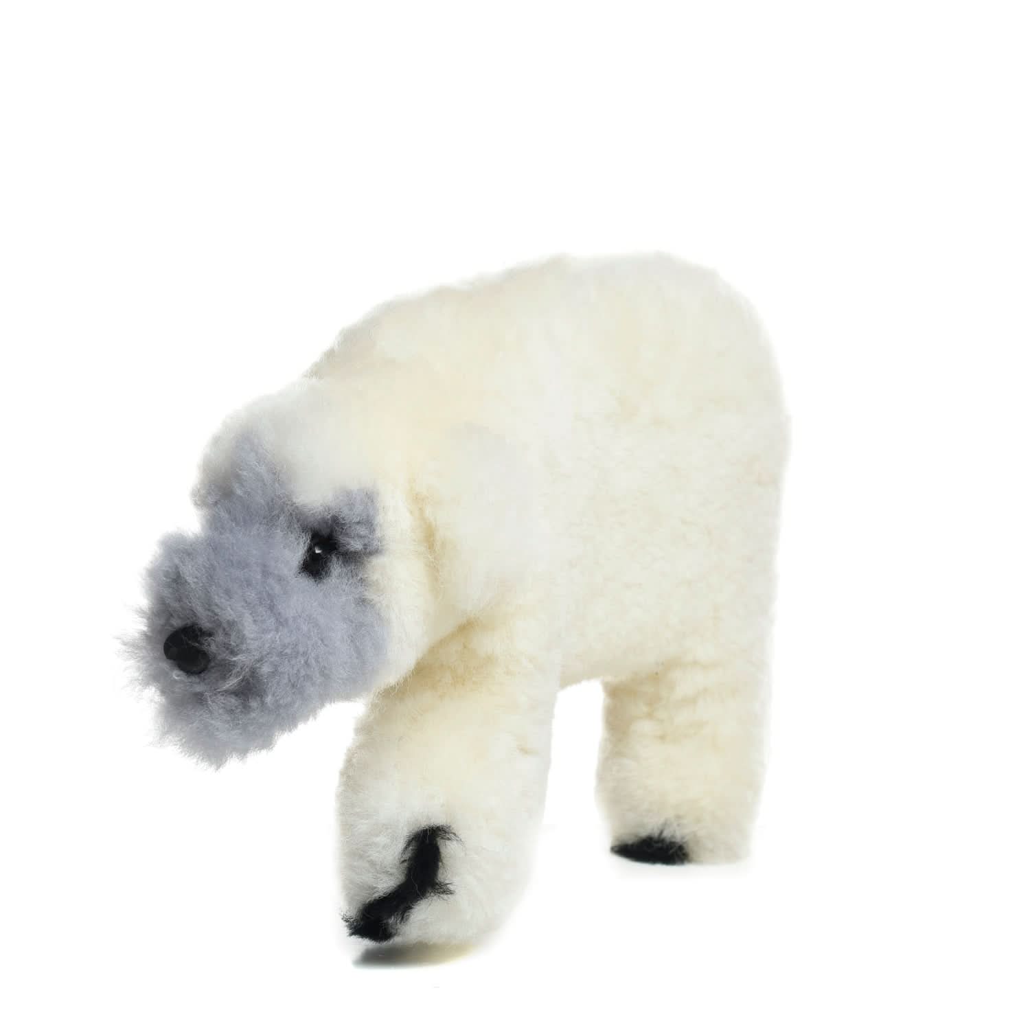 Cream sheepskin polar bear plush toy with black nose and paws, side view. - Yellow Earth Australia
