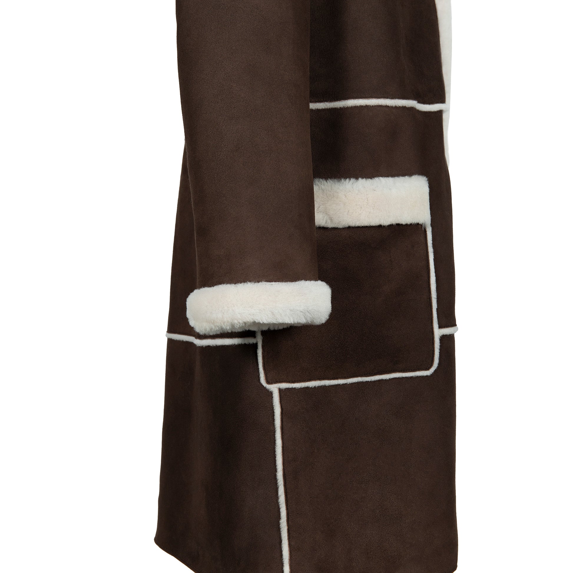 Brown sheepskin coat with white wool trim and piping detail, side view. - Yellow Earth Australia