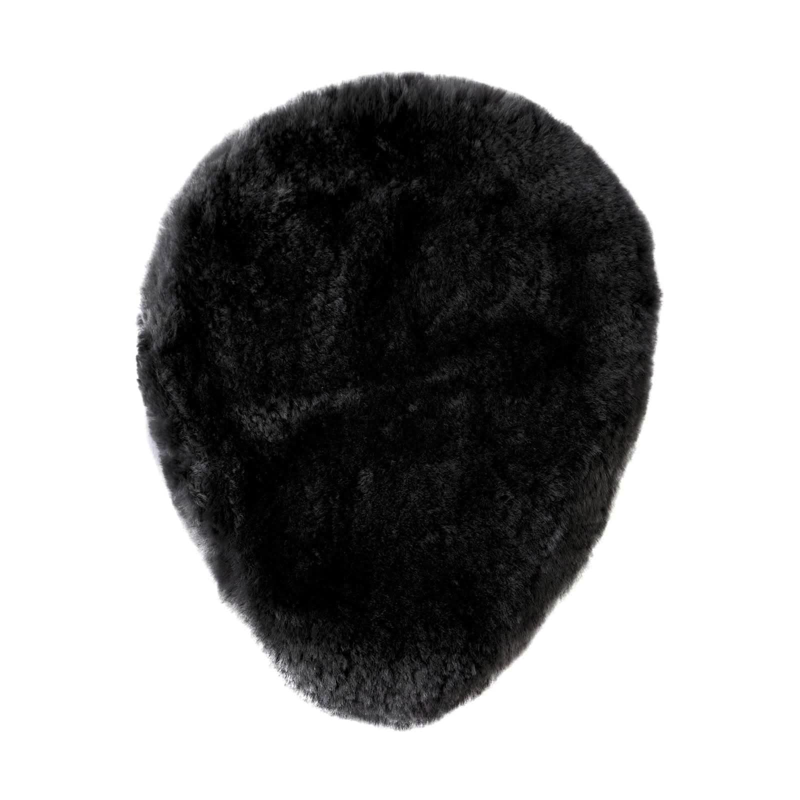 Black sheepskin rug with dense wool pile, overhead view showing full oval shape. - Yellow Earth Australia