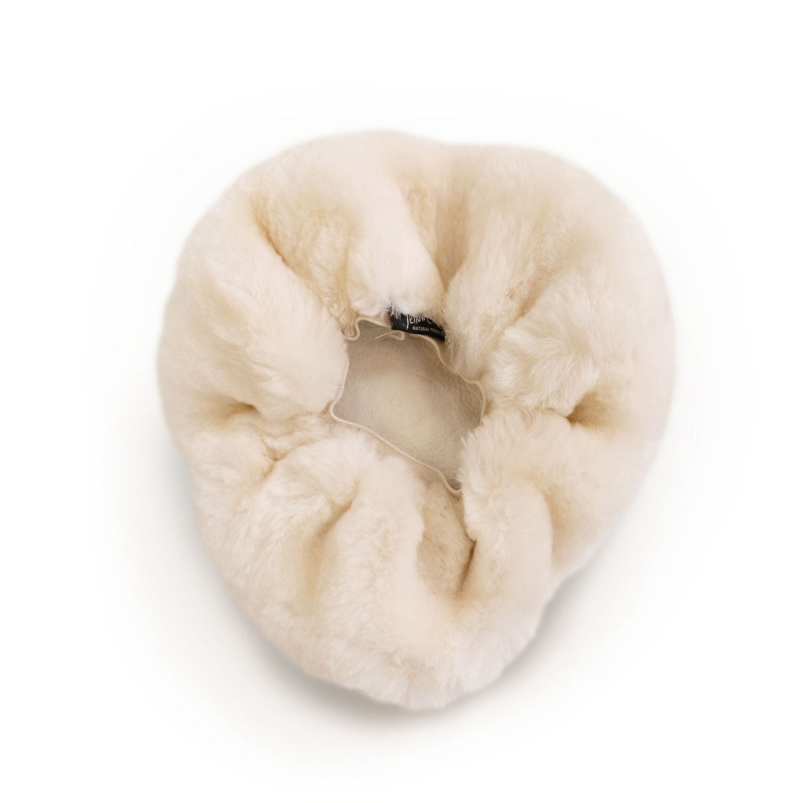 Cream sheepskin neck pillow viewed from above showing fluffy wool texture. - Yellow Earth Australia