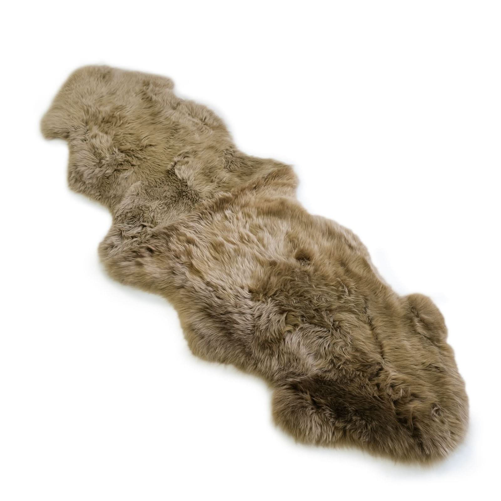 Natural sheepskin rug with curly wool texture shown from above in cream beige tone. - Yellow Earth Australia