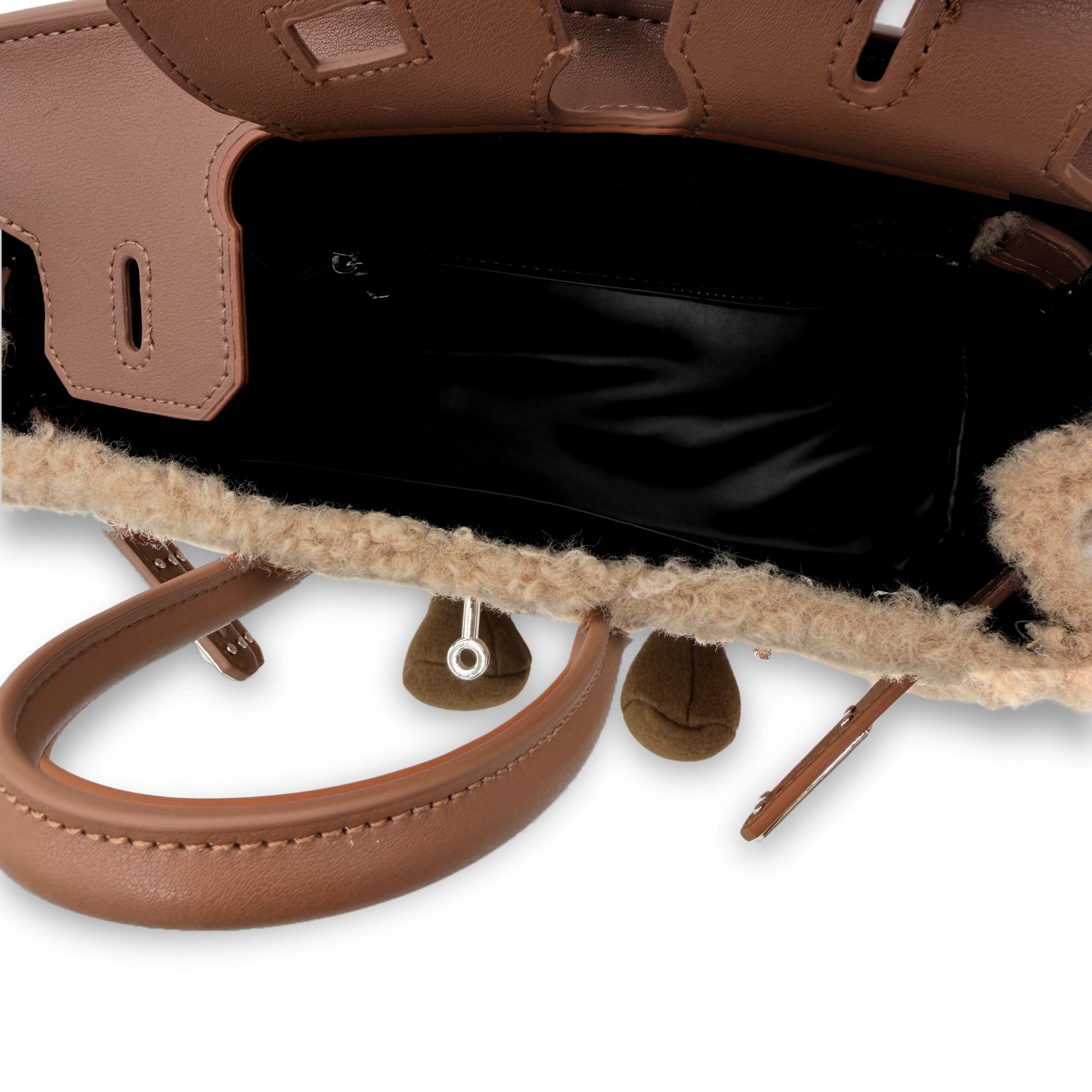 Tan leather handbag with natural sheepskin wool lining, interior view showing handles. - Yellow Earth Australia