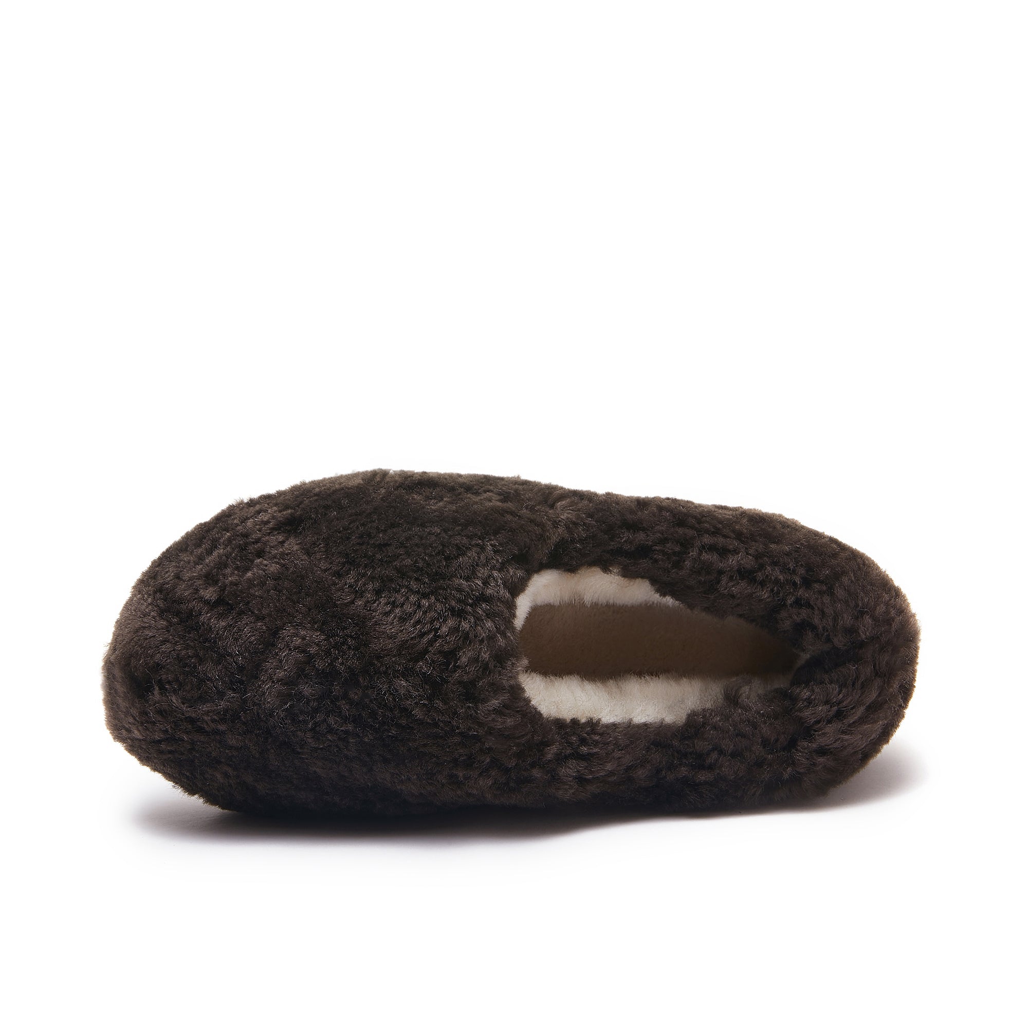 Dark brown sheepskin slipper with soft wool lining, viewed from the side angle. - Yellow Earth Australia