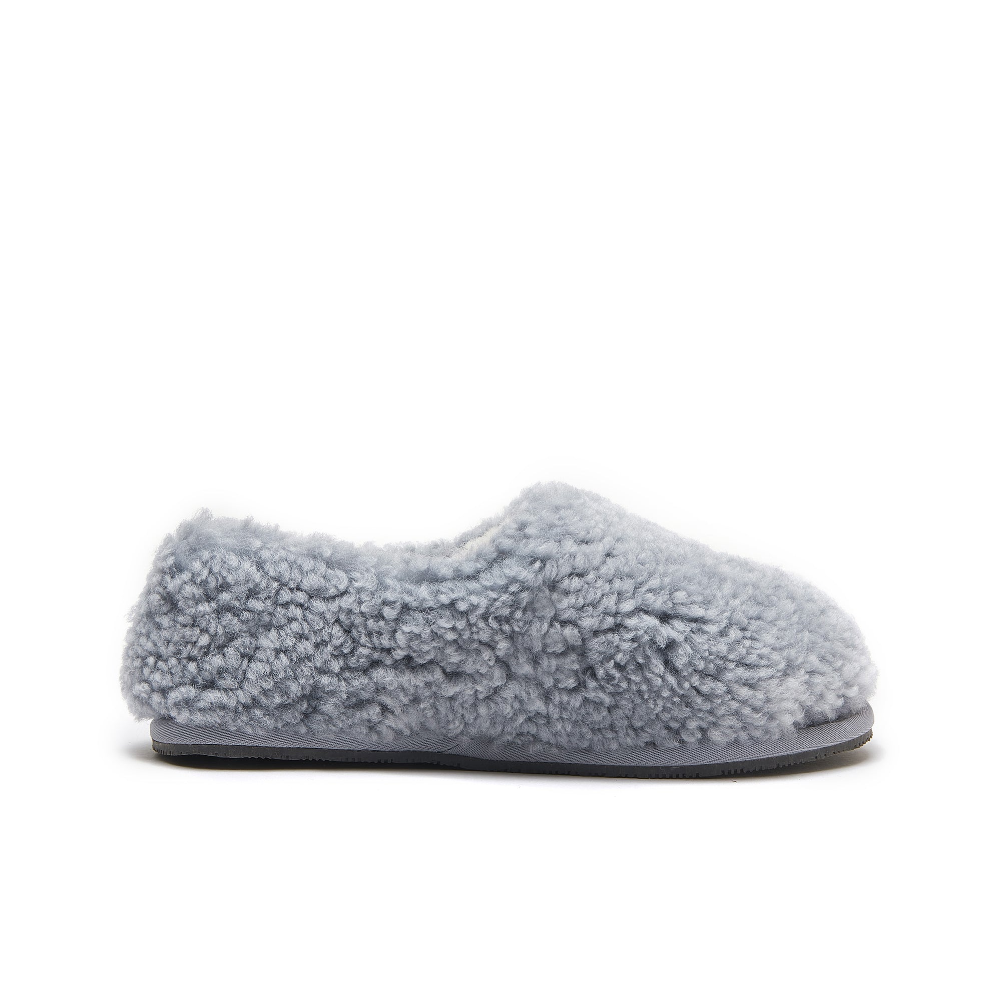 Grey sheepskin slipper with fluffy wool upper and grey sole, side view. - Yellow Earth Australia