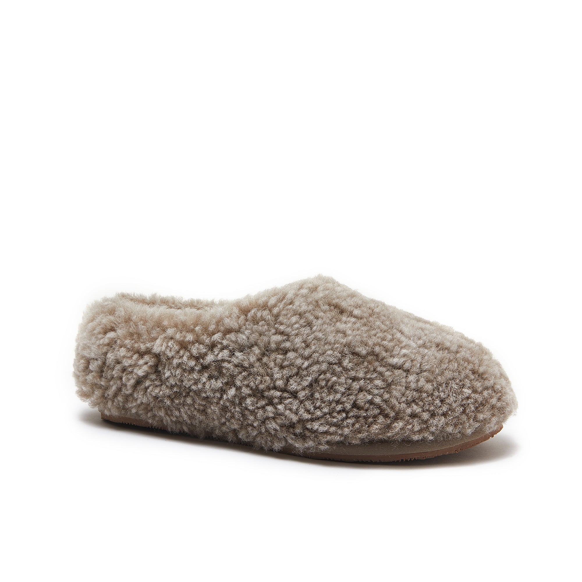 Beige sheepskin slipper with curly wool upper and brown sole, shown from side angle. - Yellow Earth Australia
