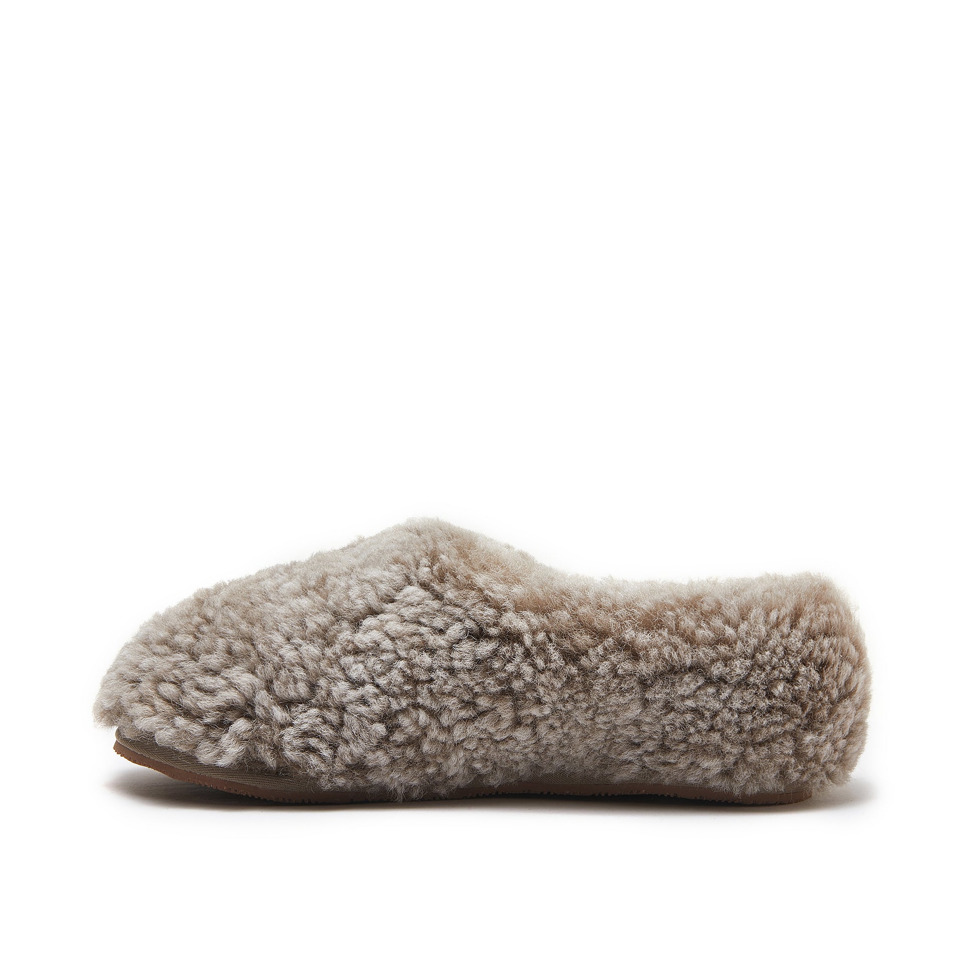 Beige sheepskin slipper with curly wool upper and sole, side view. - Yellow Earth Australia