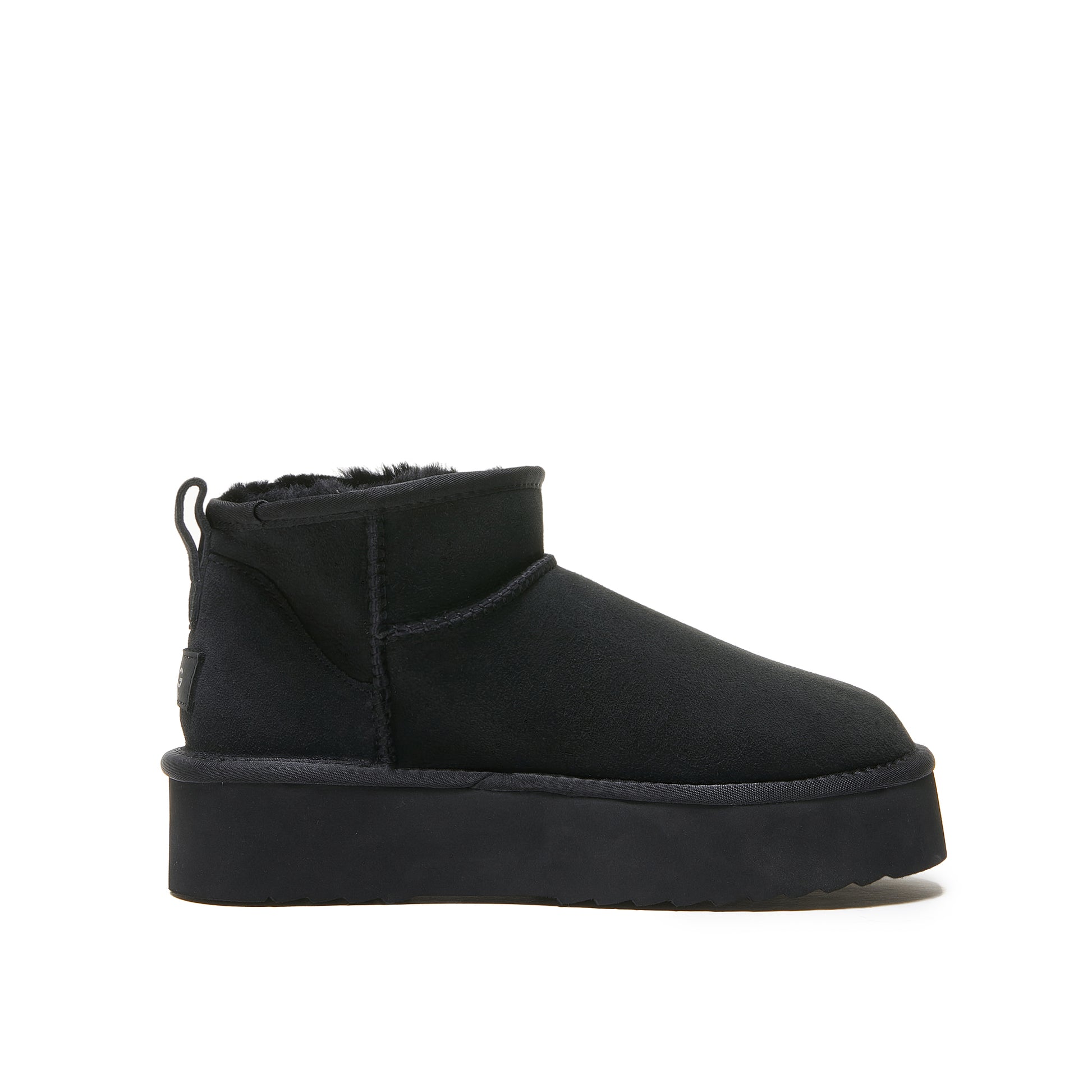 Black sheepskin platform ankle boot with fur-lined collar, side view. - Yellow Earth Australia