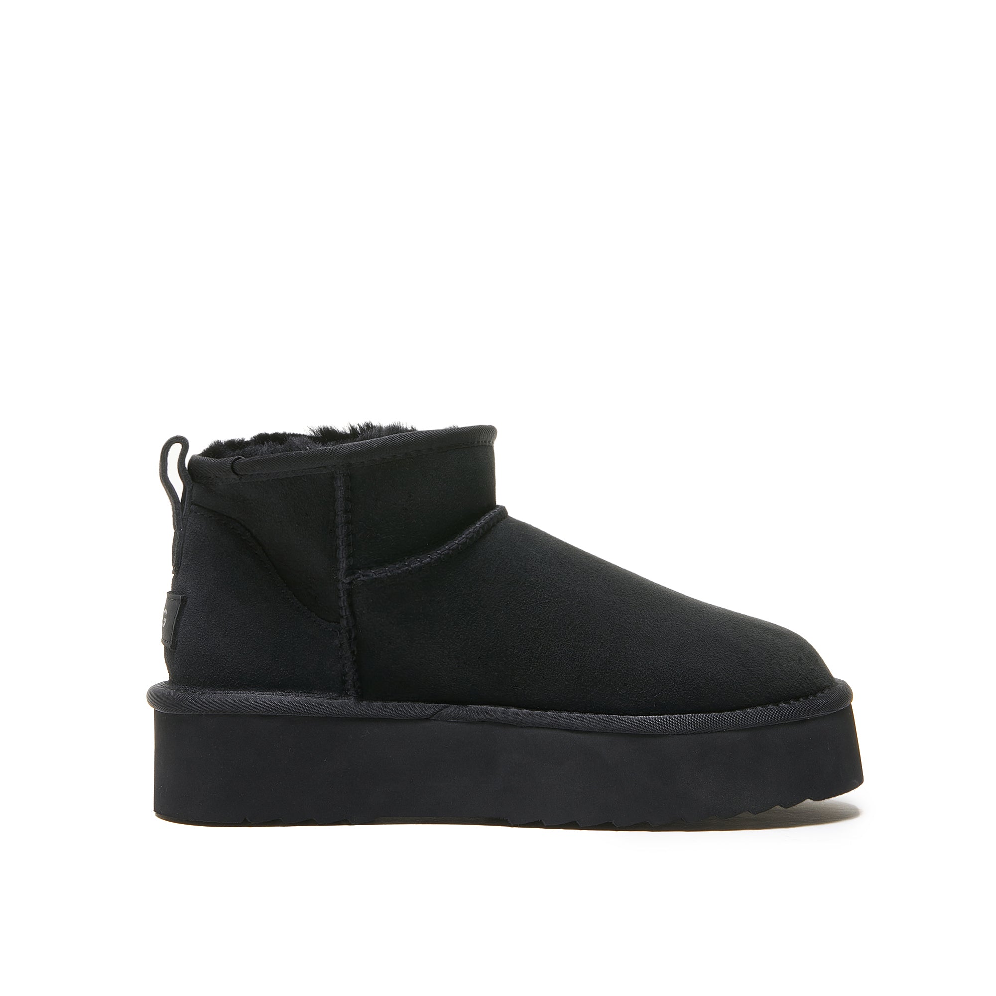 Black sheepskin platform ankle boot with fur-lined collar, side view. - Yellow Earth Australia