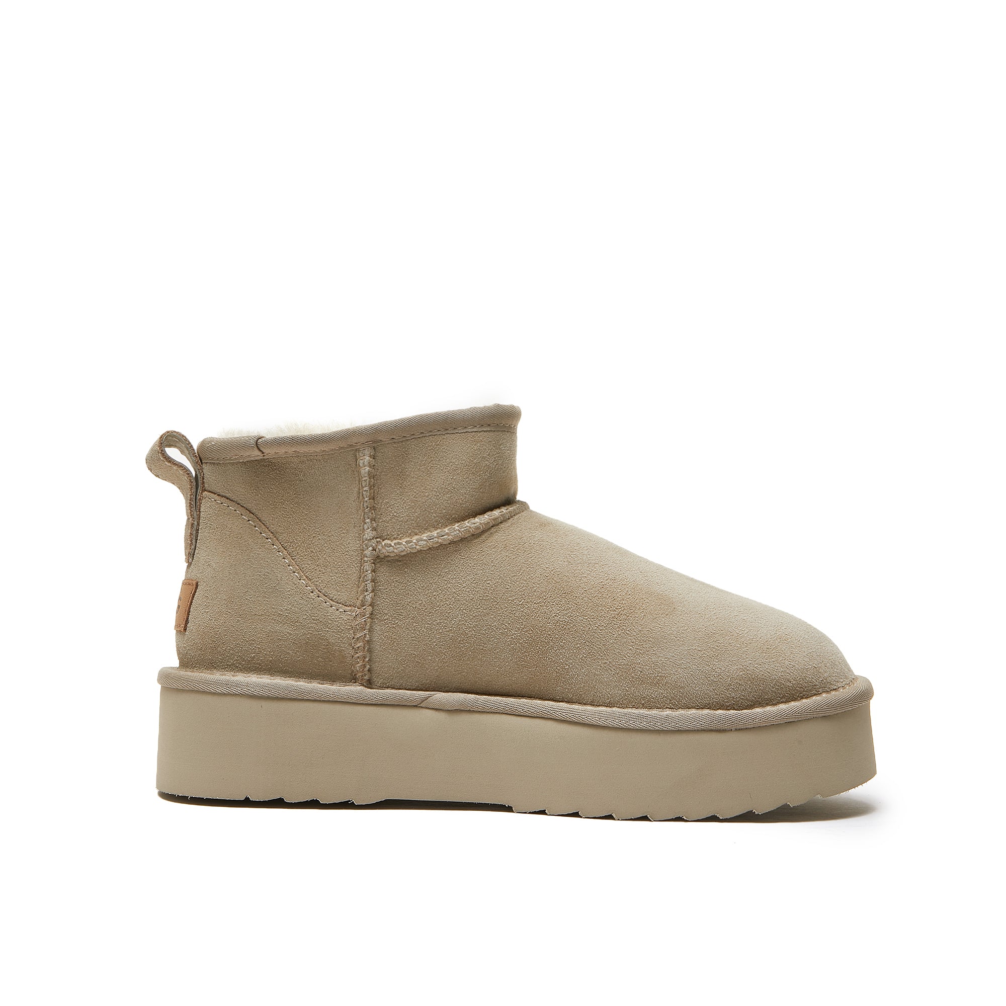 Beige platform mini sheepskin boot shown from the side against white background. - Yellow Earth Australia