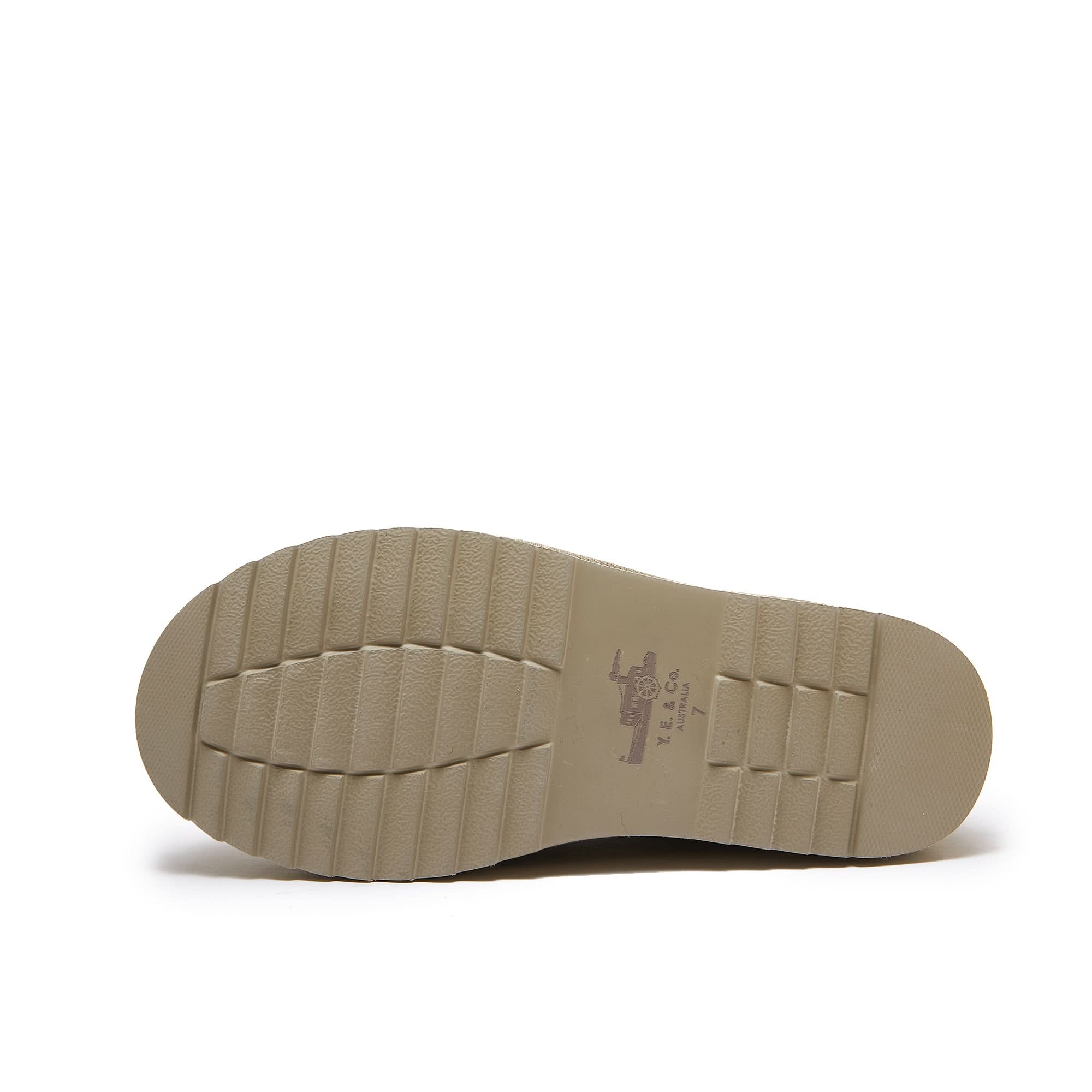 Cream sheepskin slip-on shoe sole view showing textured rubber outsole. - Yellow Earth Australia