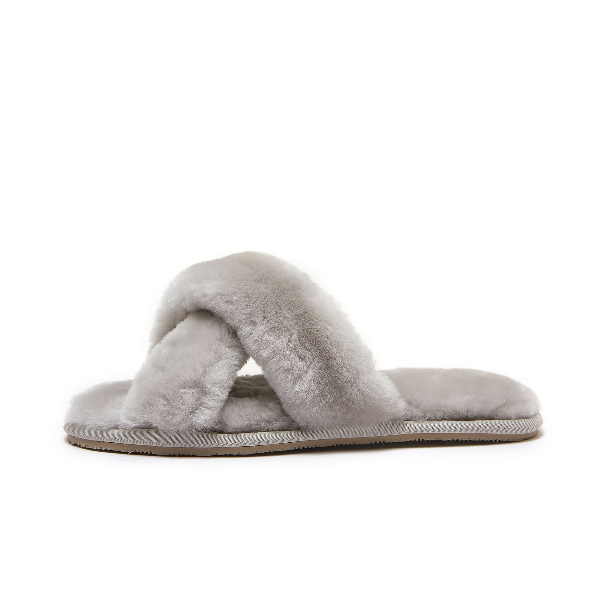 Cream sheepskin slip-on slipper with soft wool upper, viewed from the side. - Yellow Earth Australia