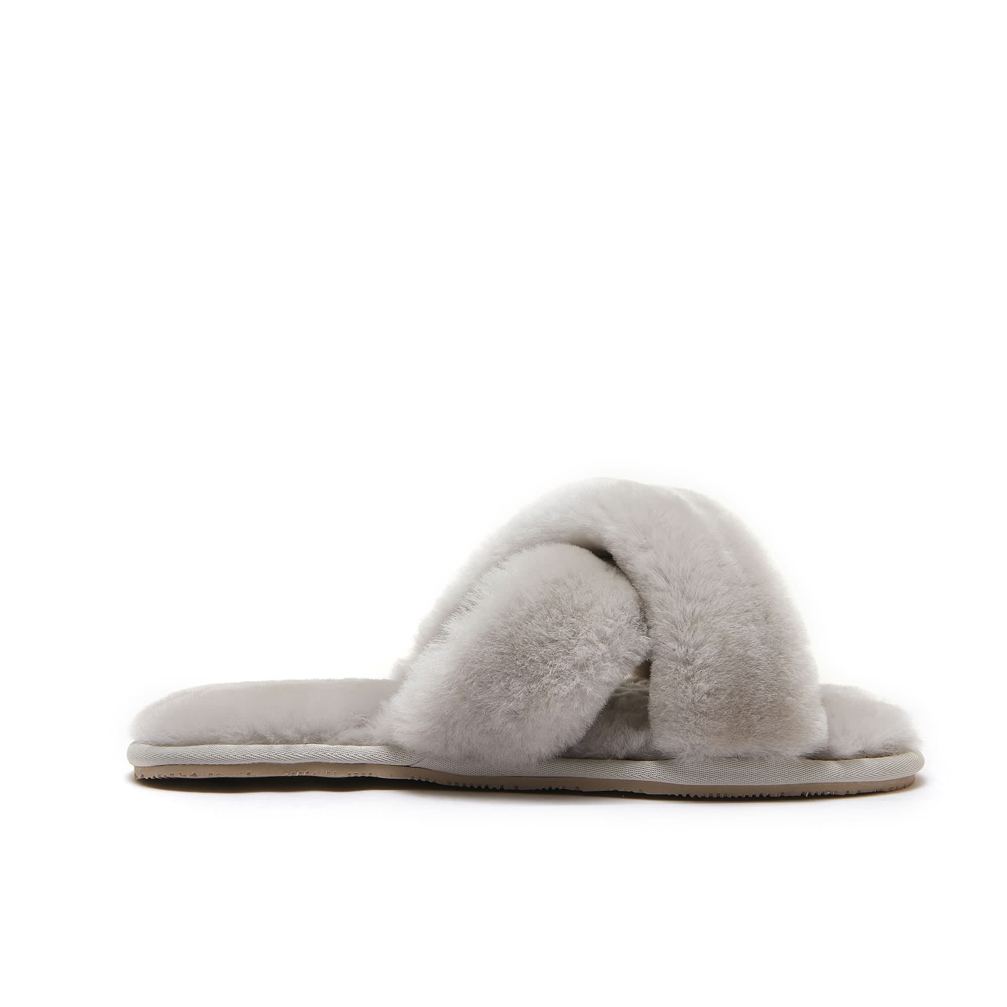 Cream sheepskin slippers with fluffy wool upper, side view on white background. - Yellow Earth Australia