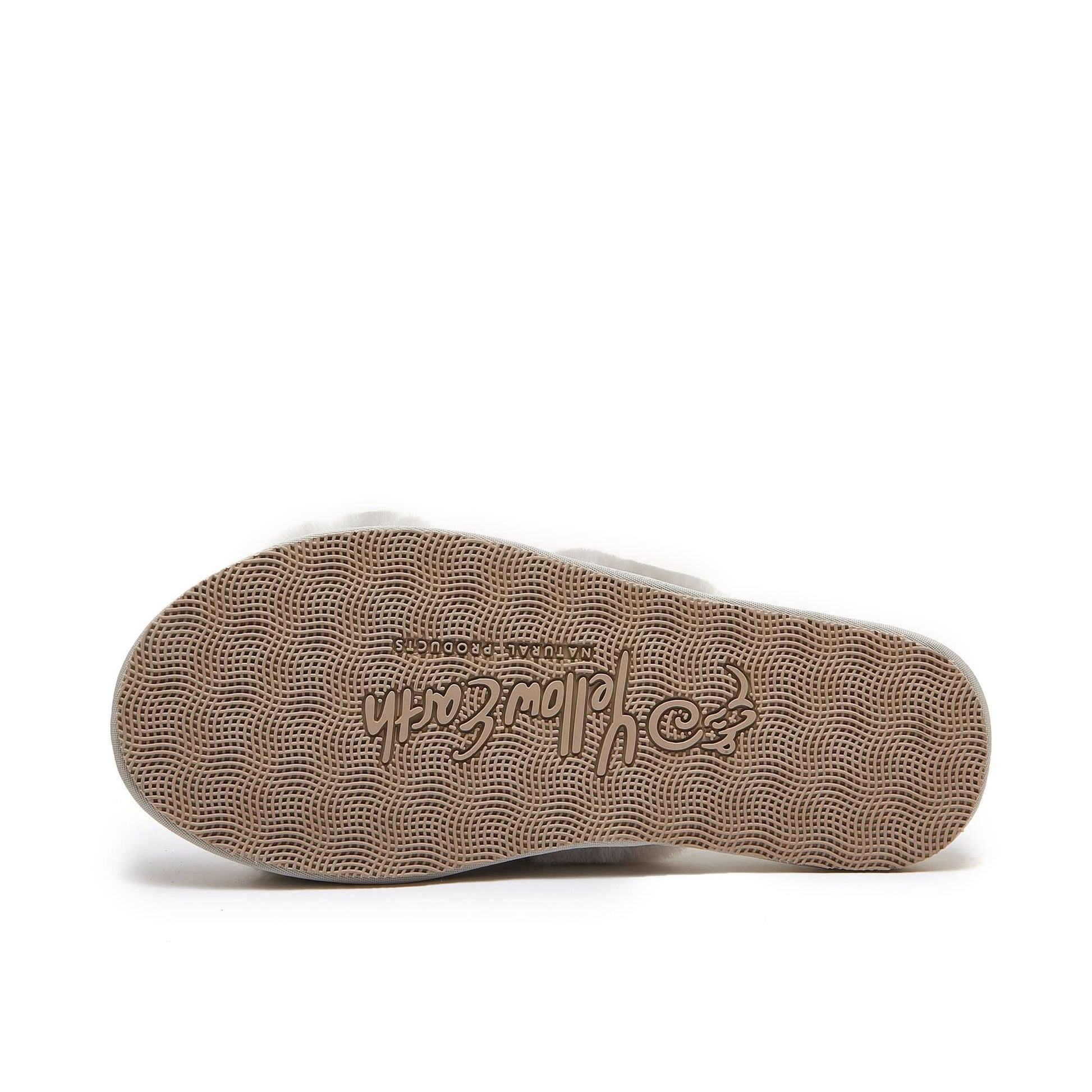 Beige sheepskin slipper sole showing textured grip pattern from bottom view. - Yellow Earth Australia