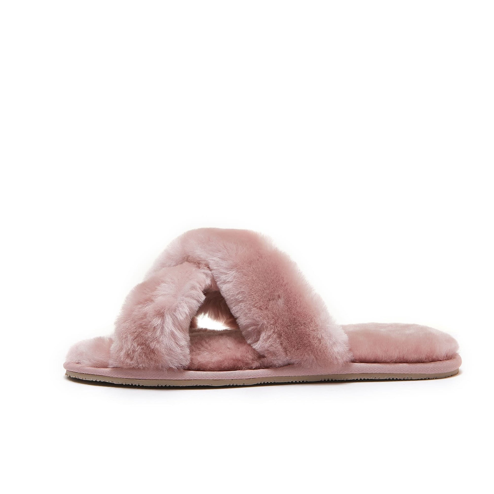 Pink sheepskin slider with fluffy wool upper and flat sole, side view. - Yellow Earth Australia