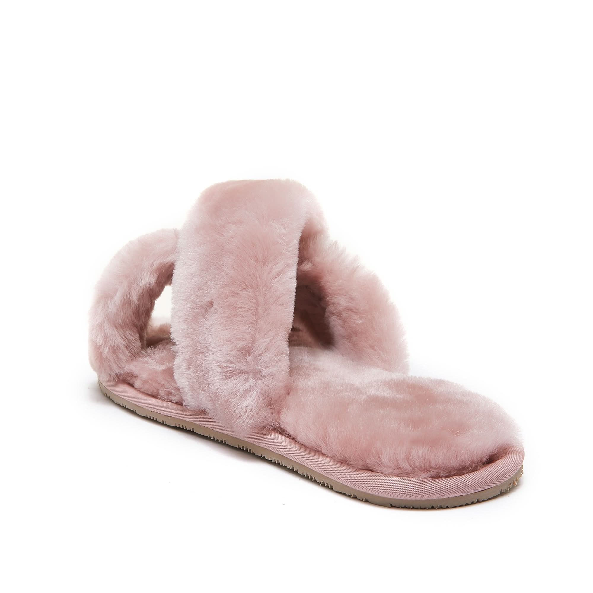 Pink sheepskin slipper with fluffy wool lining and tan sole, side view. - Yellow Earth Australia
