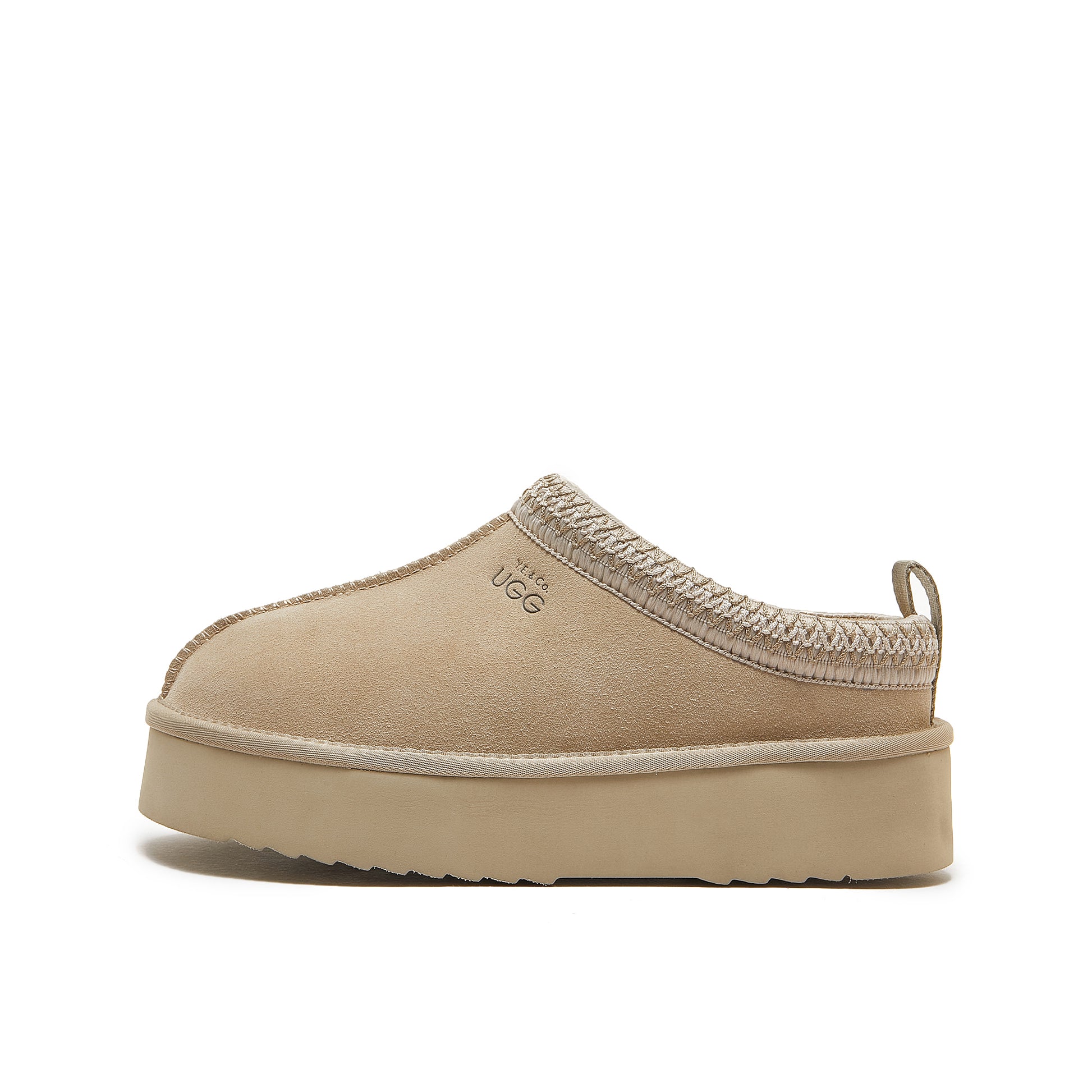 Beige platform slip-on slipper with sheepskin lining, side view. - Yellow Earth Australia