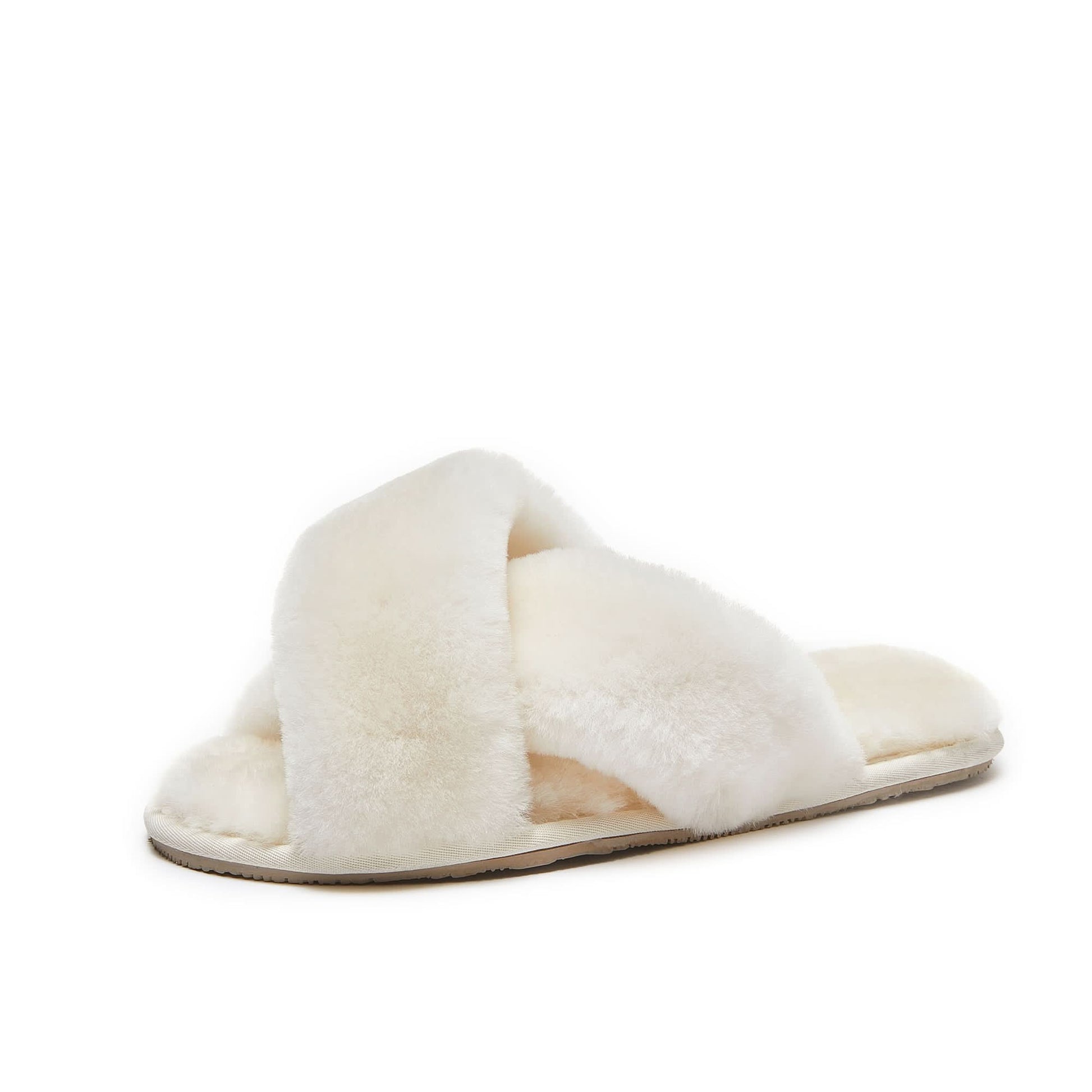 White sheepskin crossover slide slippers with fluffy wool lining, side view. - Yellow Earth Australia