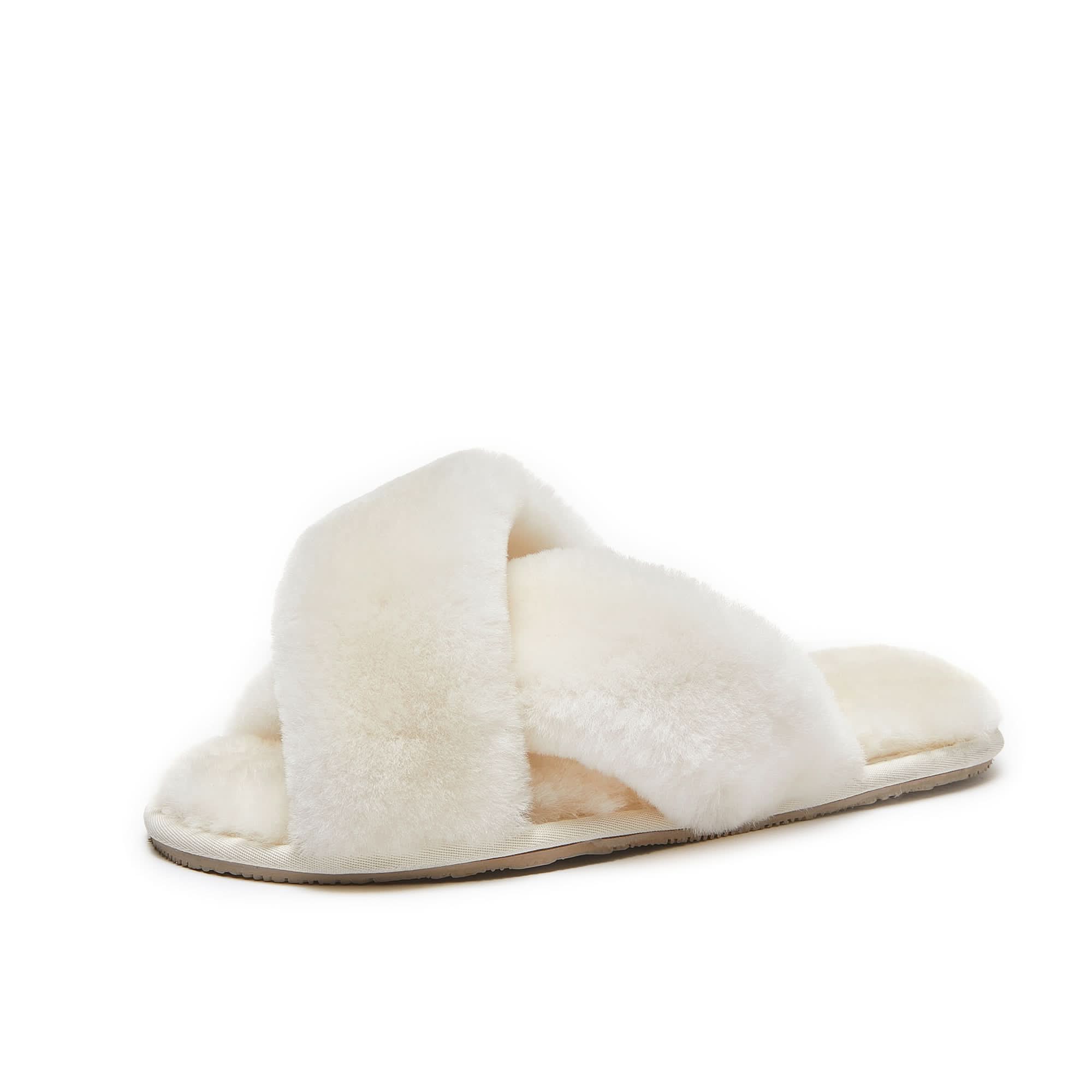 White sheepskin crossover slide slippers with fluffy wool lining, side view. - Yellow Earth Australia
